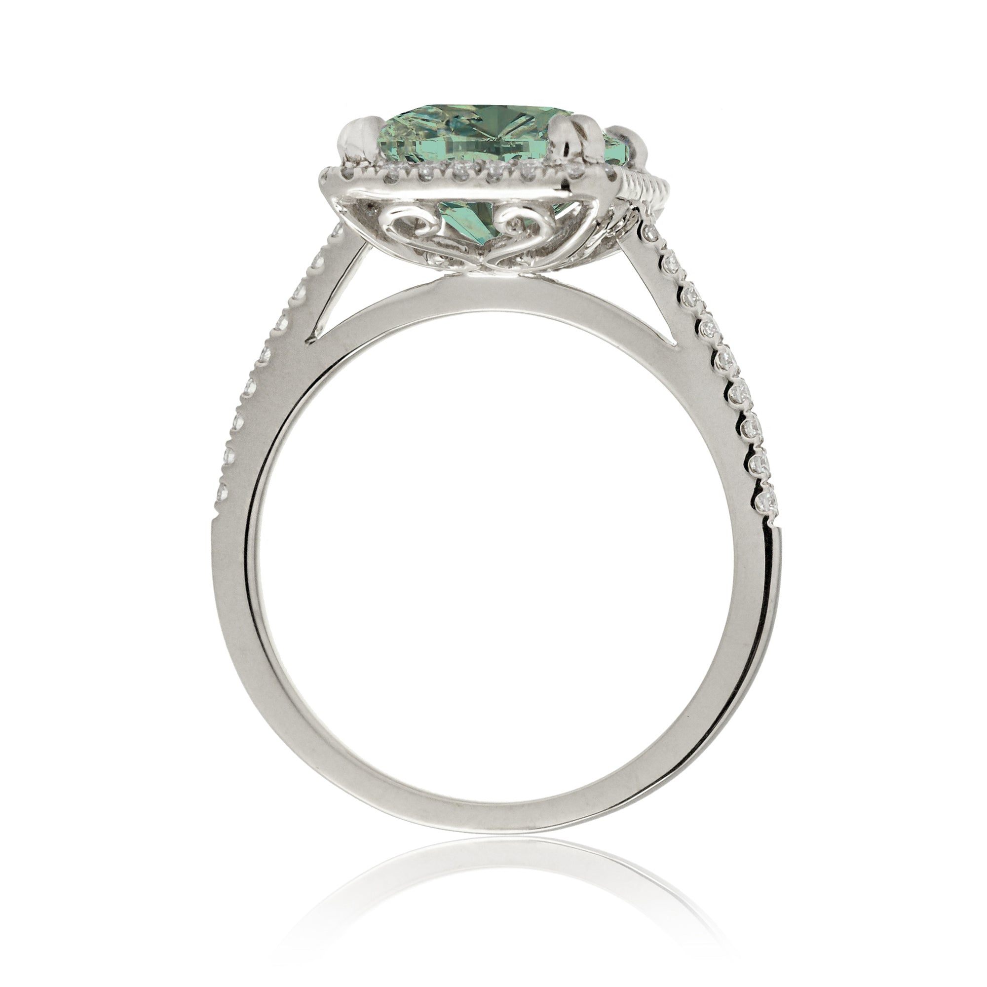 Cushion cut green sapphire engagement ring The signature diamond halo in white gold
