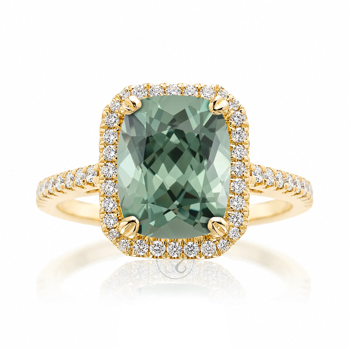Cushion cut green sapphire engagement ring The signature diamond halo in yellow gold