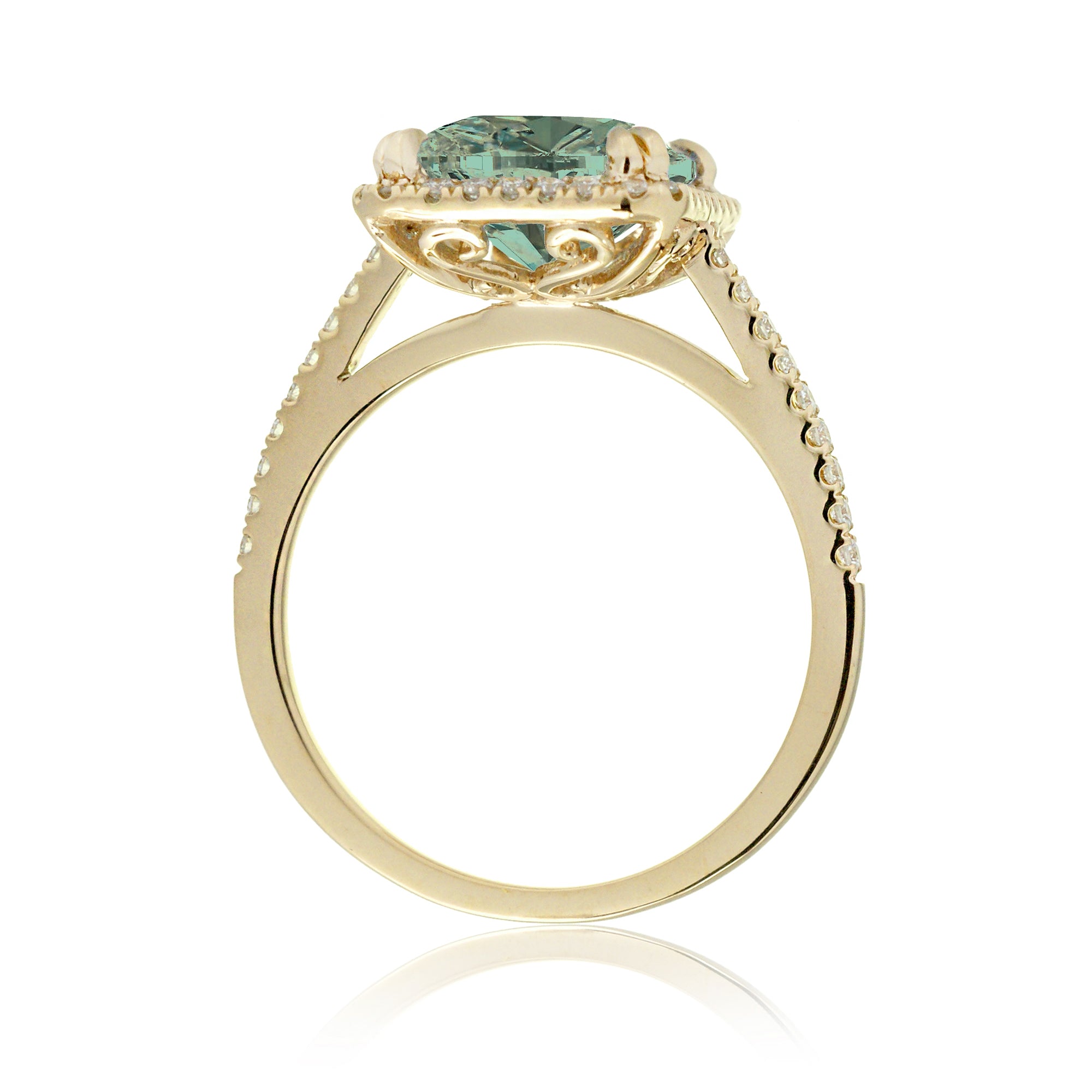 Cushion cut green sapphire engagement ring The signature diamond halo in yellow gold