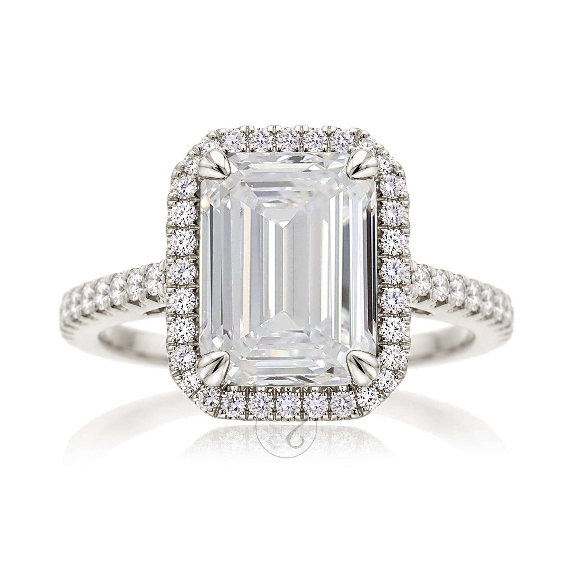 Emerald step cut diamond halo ring with a squarish band and cathedral setting white gold