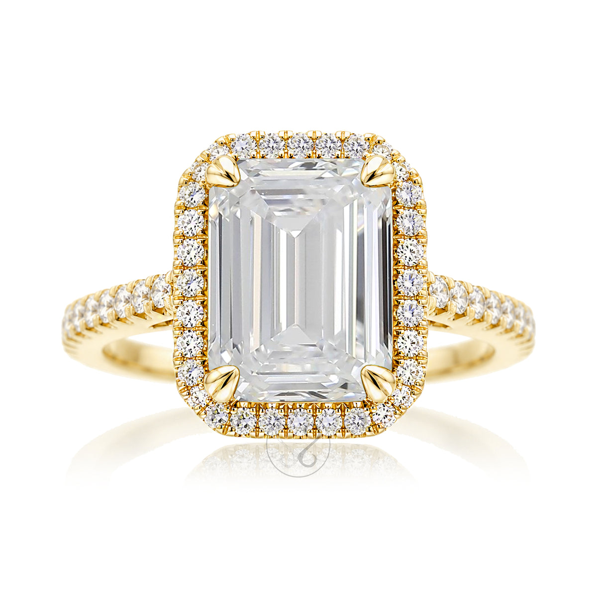Emerald step cut diamond halo ring with a squarish band and cathedral setting yellow gold
