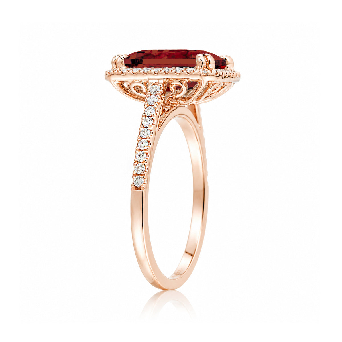 Emerald step cut ruby halo ring with a squarish band and cathedral setting rose gold