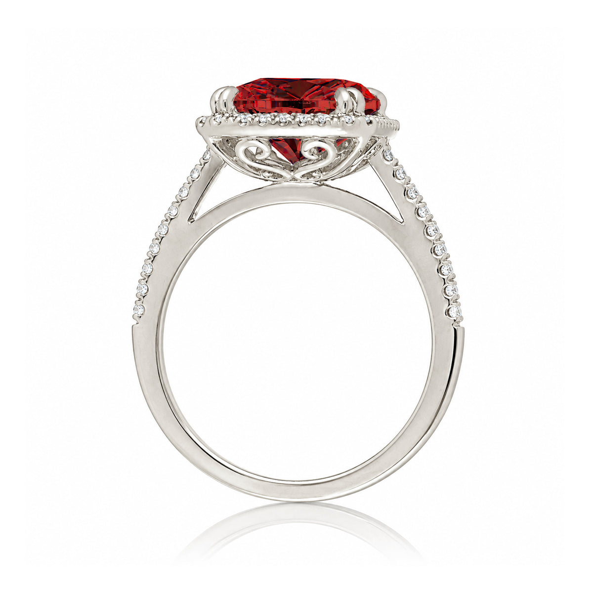 Emerald step cut ruby halo ring with a squarish band and cathedral setting white gold