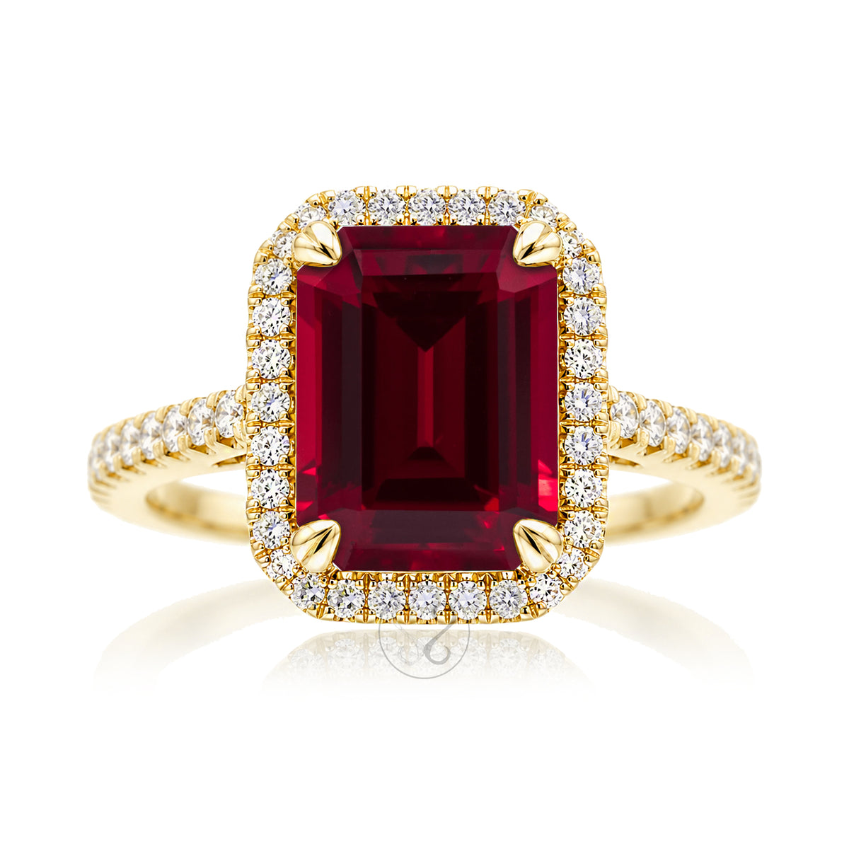Emerald step cut ruby halo ring with a squarish band and cathedral setting yellow gold