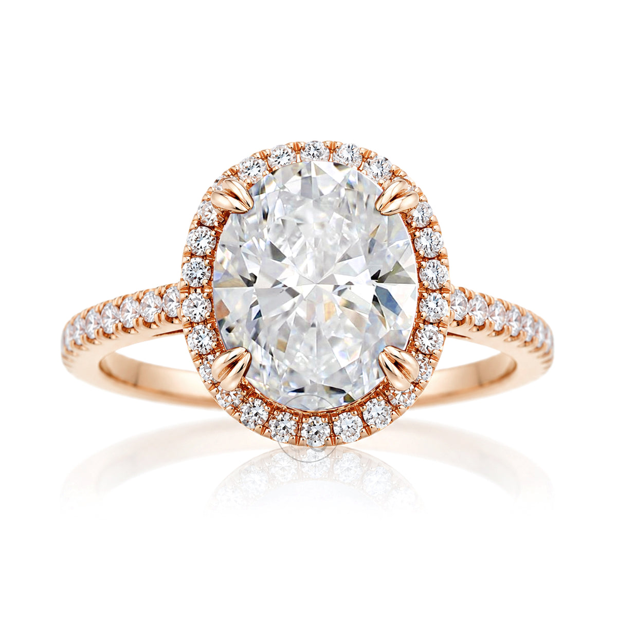 Oval diamond engagement ring with halo and cathedral setting in rose gold