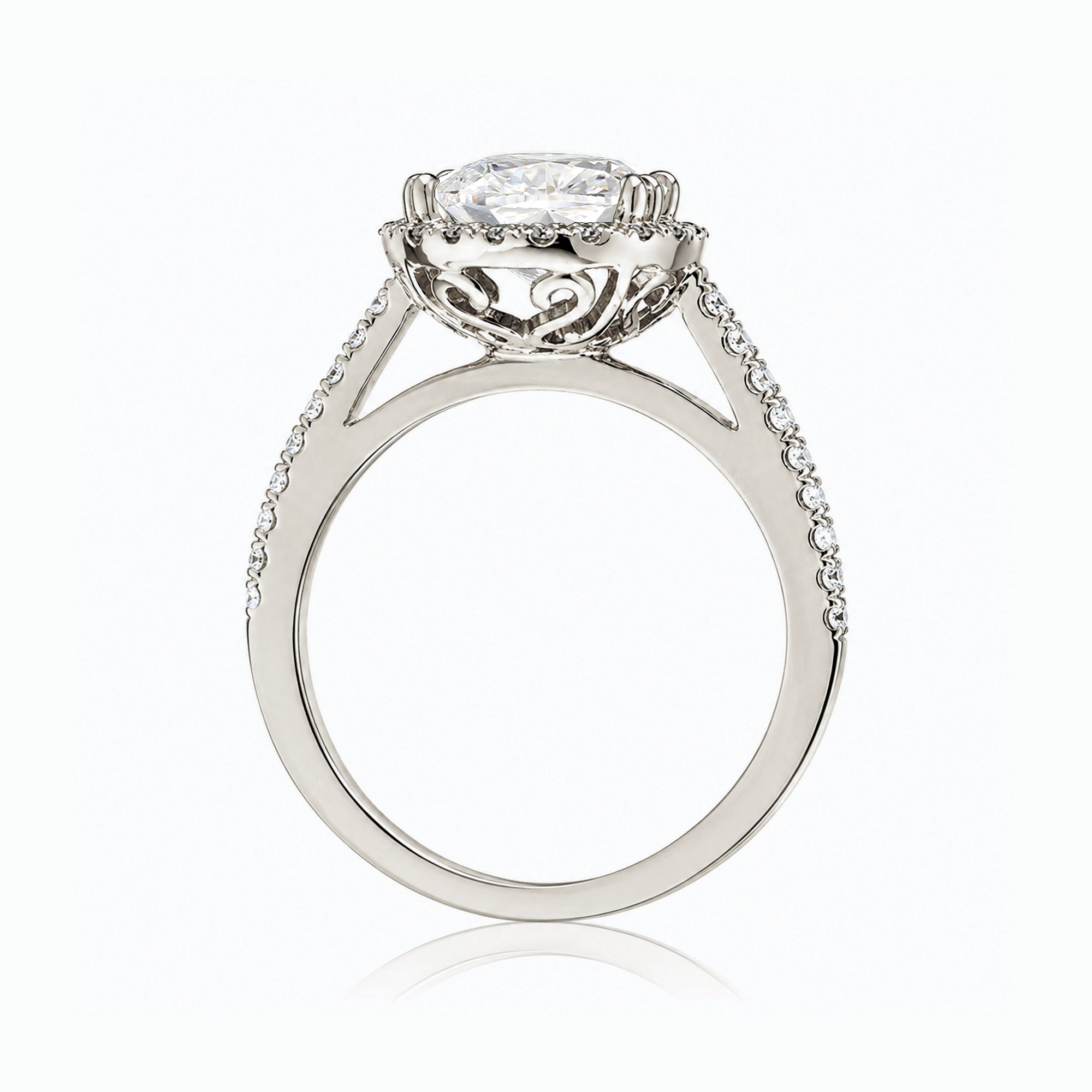 Oval diamond engagement ring with halo and cathedral setting in white gold