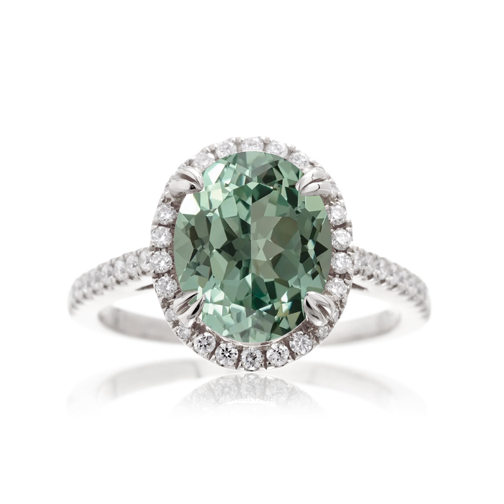 Oval green sapphire engagement ring with diamond halo in white gold
