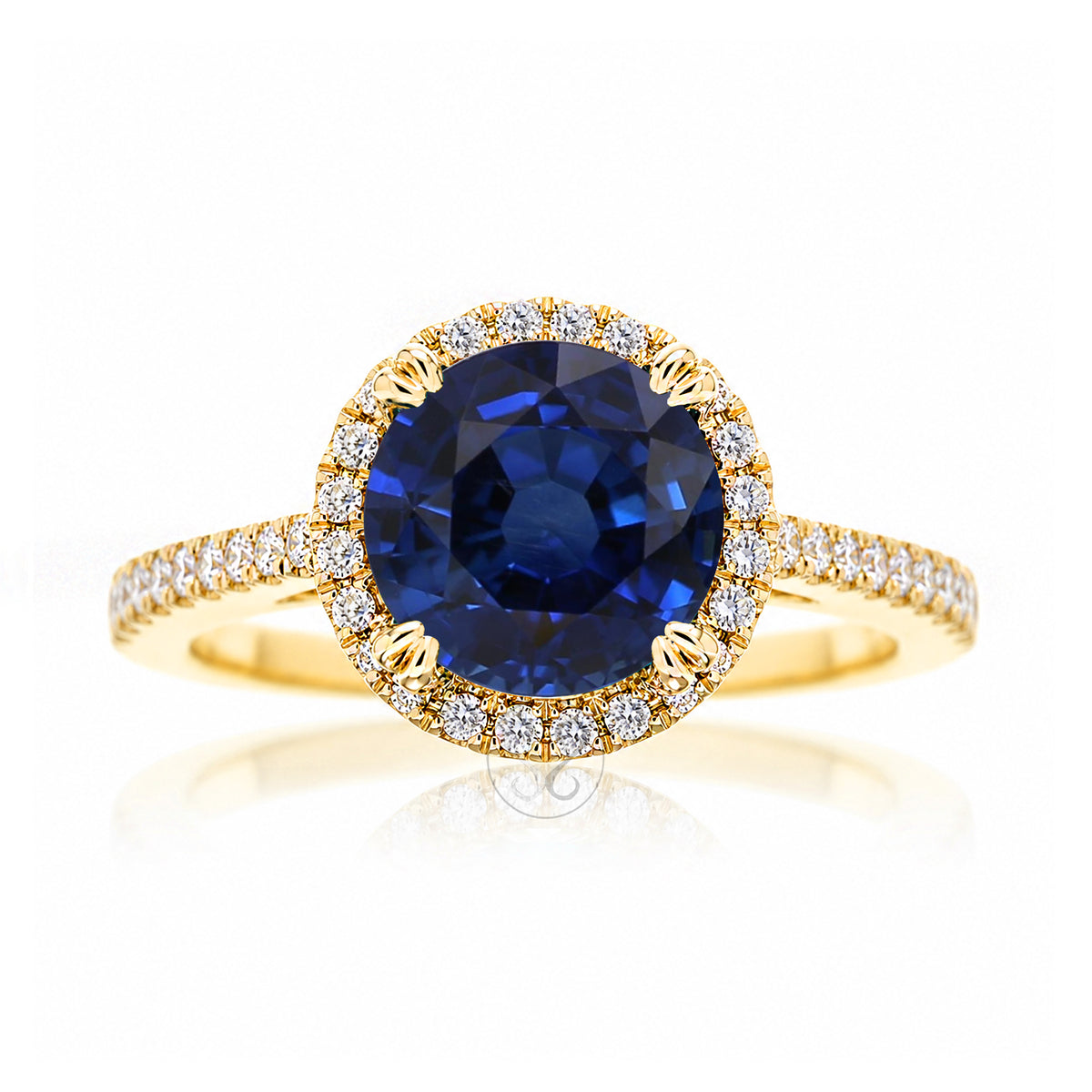 Round blue sapphire diamond halo ring with squarish diamond band yellow gold