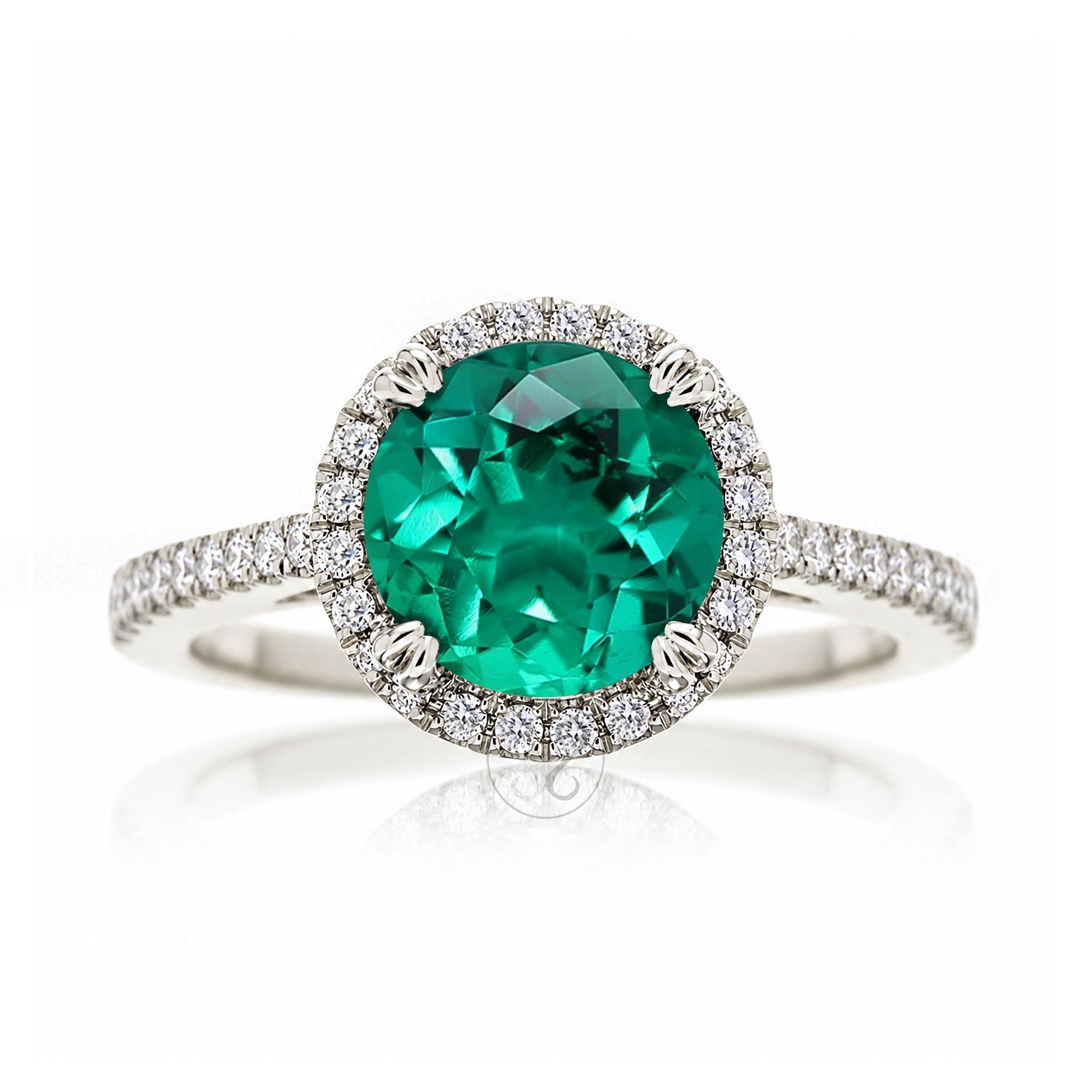 Round emerald diamond halo ring with squarish diamond band white gold