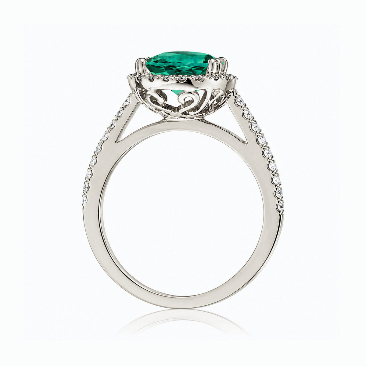 Round emerald diamond halo ring with squarish diamond band white gold