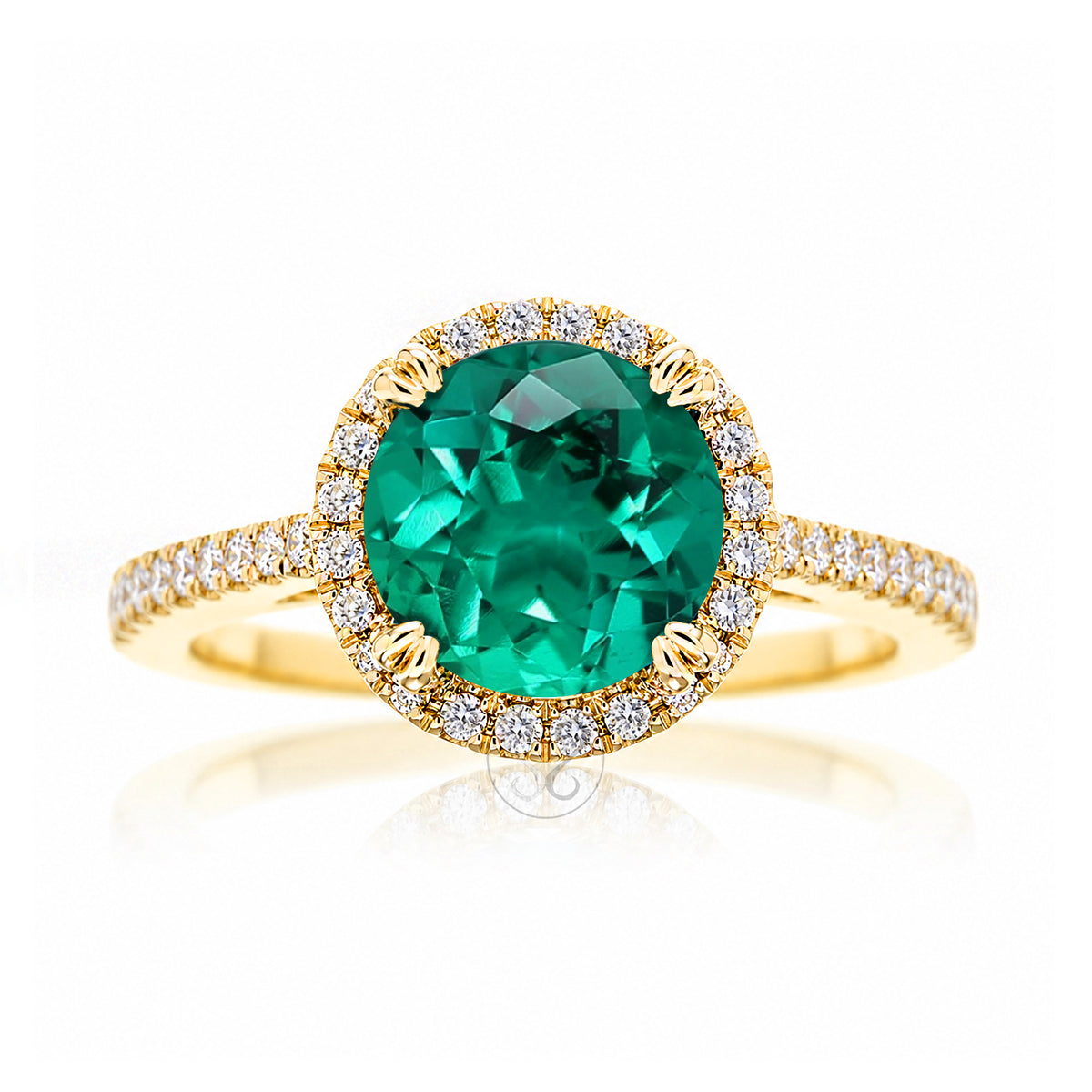 Round emerald diamond halo ring with squarish diamond band yellow gold