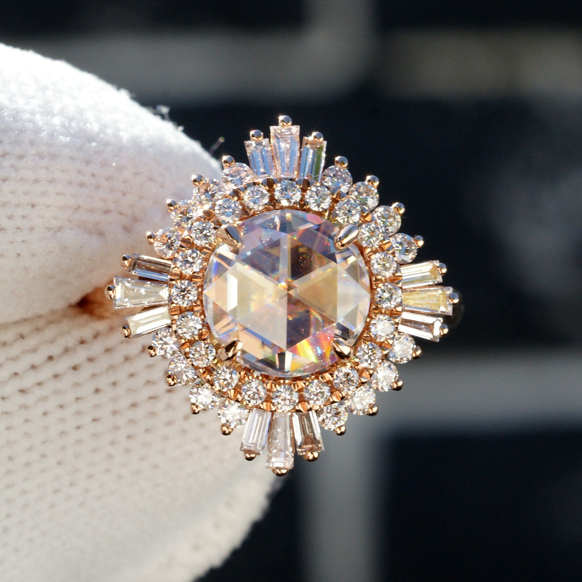 Rose cut moissanite in an art-deco vintage accent rose gold setting with natural side diamonds