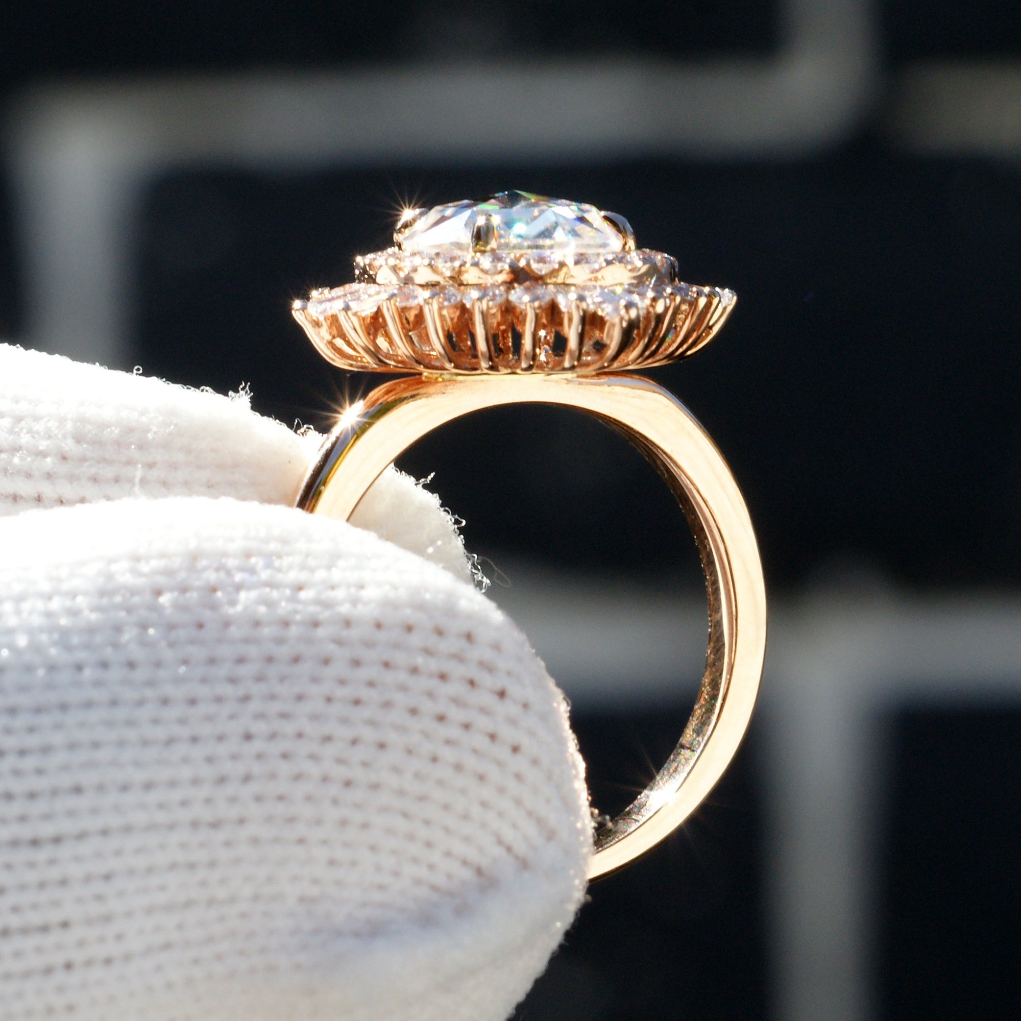 Rose cut moissanite in an art-deco vintage accent rose gold setting with natural side diamonds
