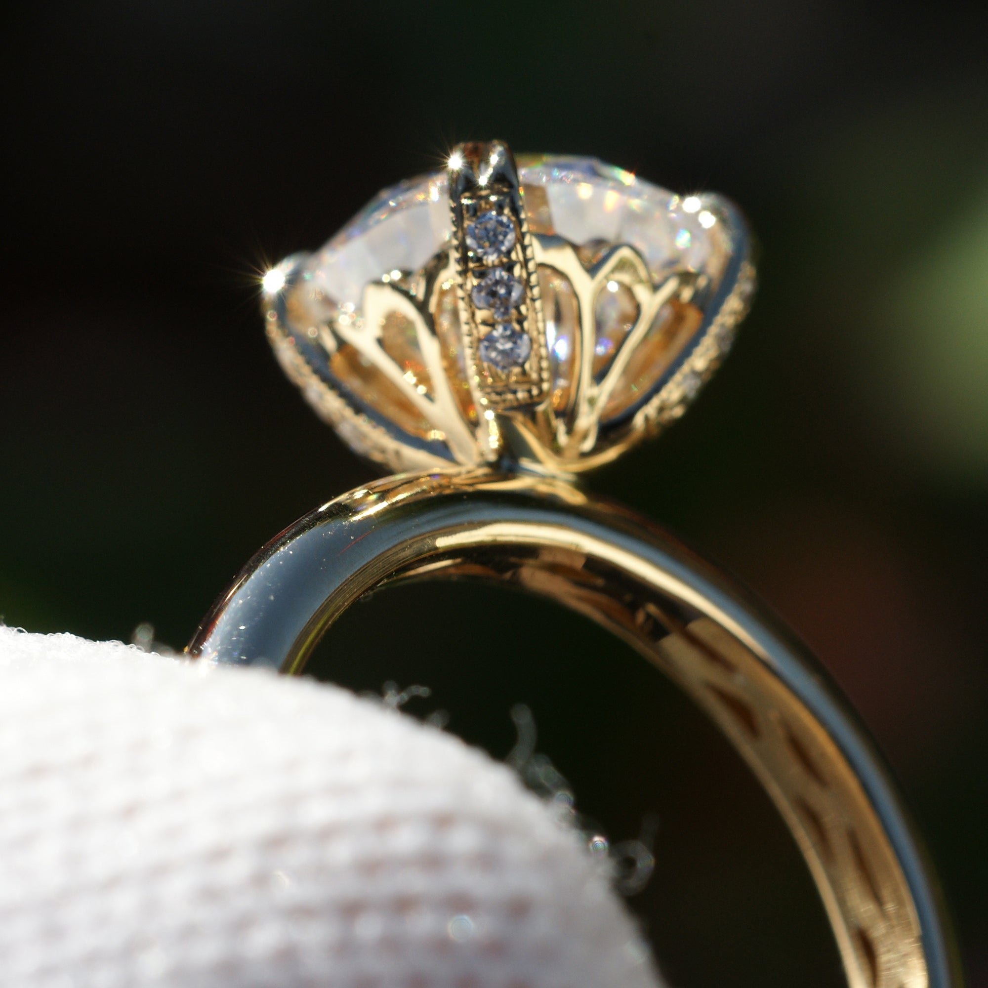 Cushion cut moissanite solitaire engagement ring in yellow gold The Leila basket view