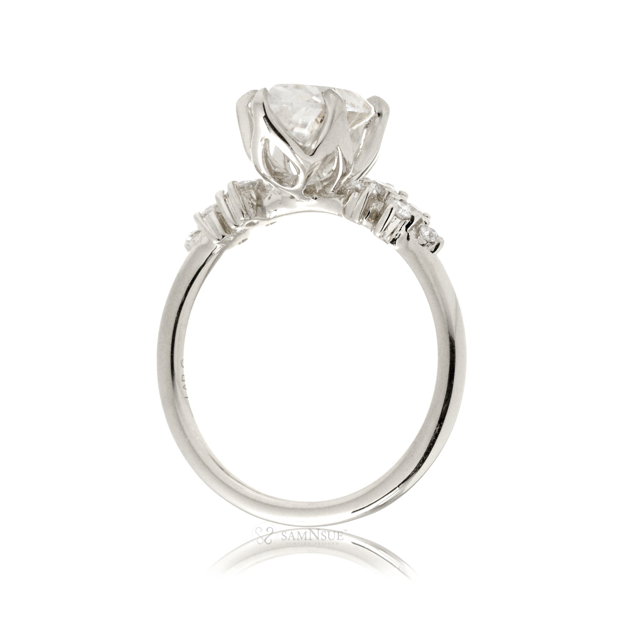 Marquise cut moissanite crown basket and diamond side stone ring white gold