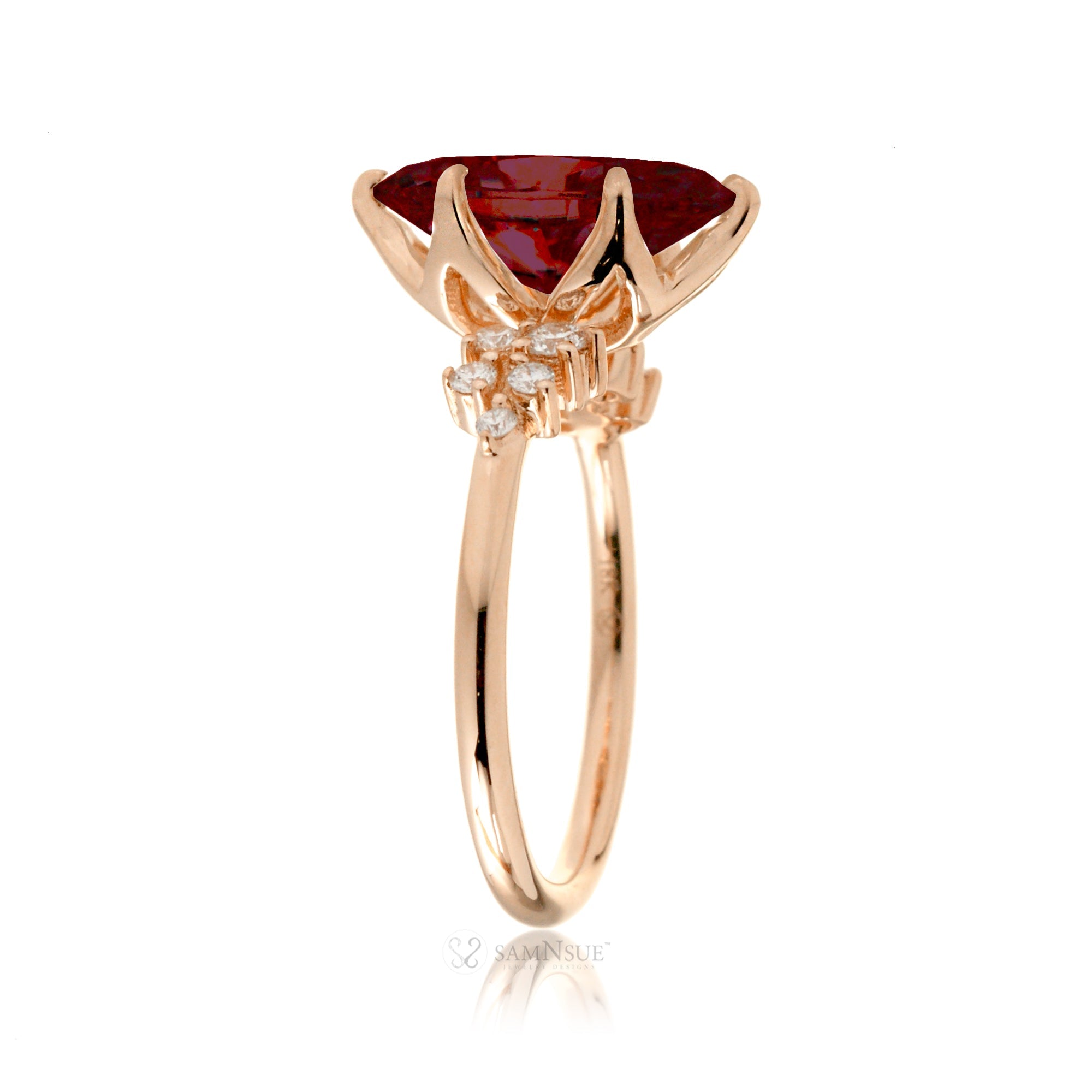 Marquise ruby and diamond solitaire engagement ring in rose gold