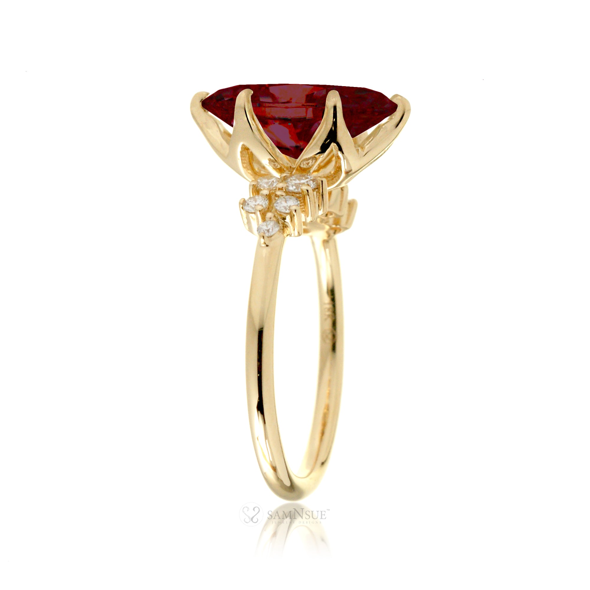 Marquise ruby and diamond solitaire engagement ring in yellow gold