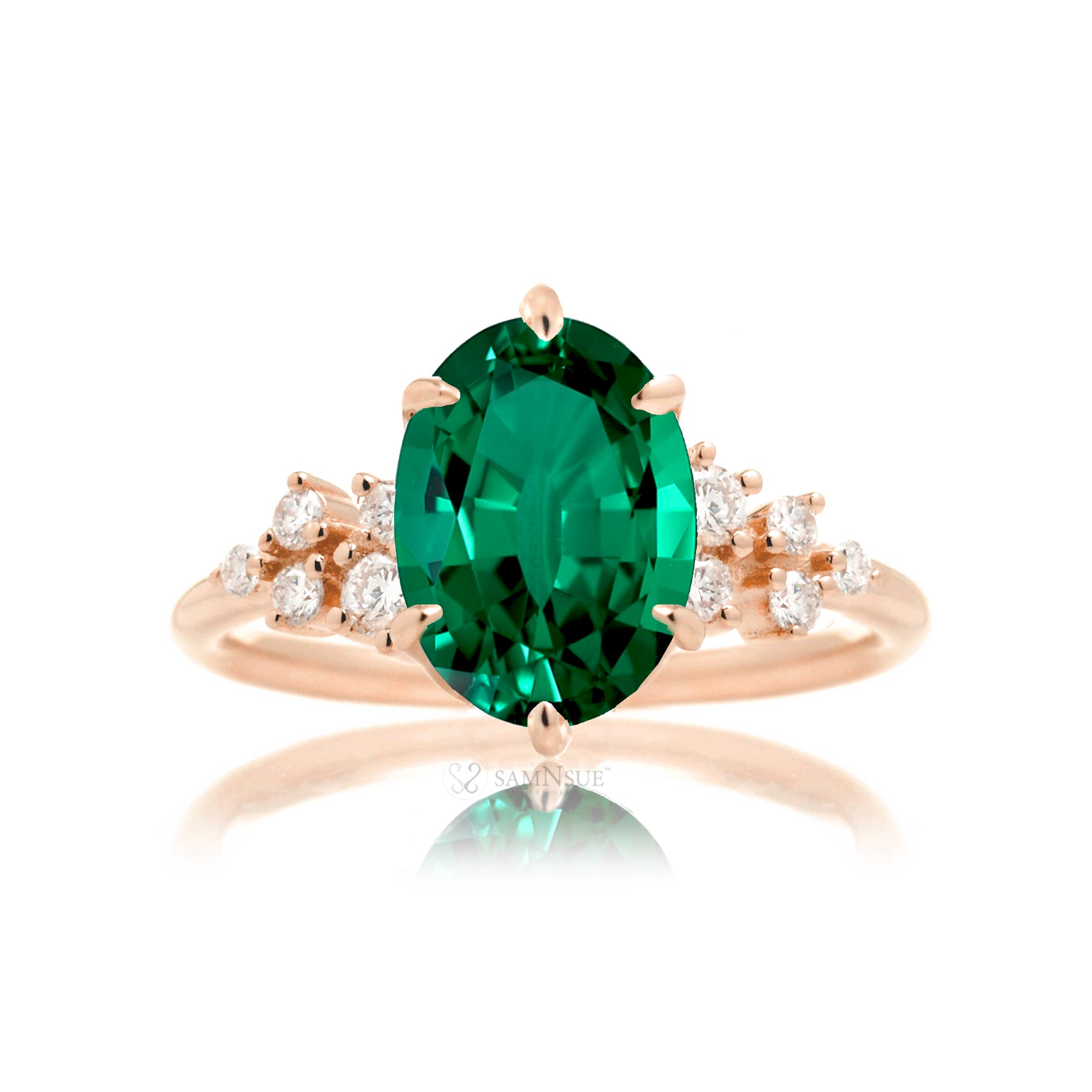 Oval emerald ring with diamond accent on rose gold