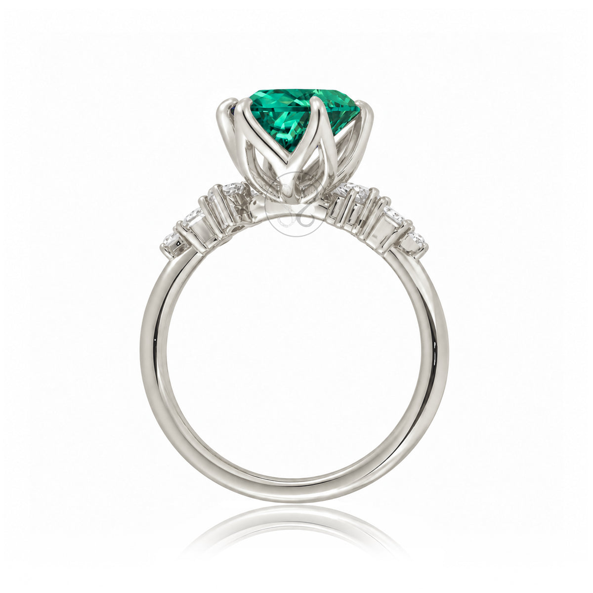 Oval emerald ring with diamond accent on white gold