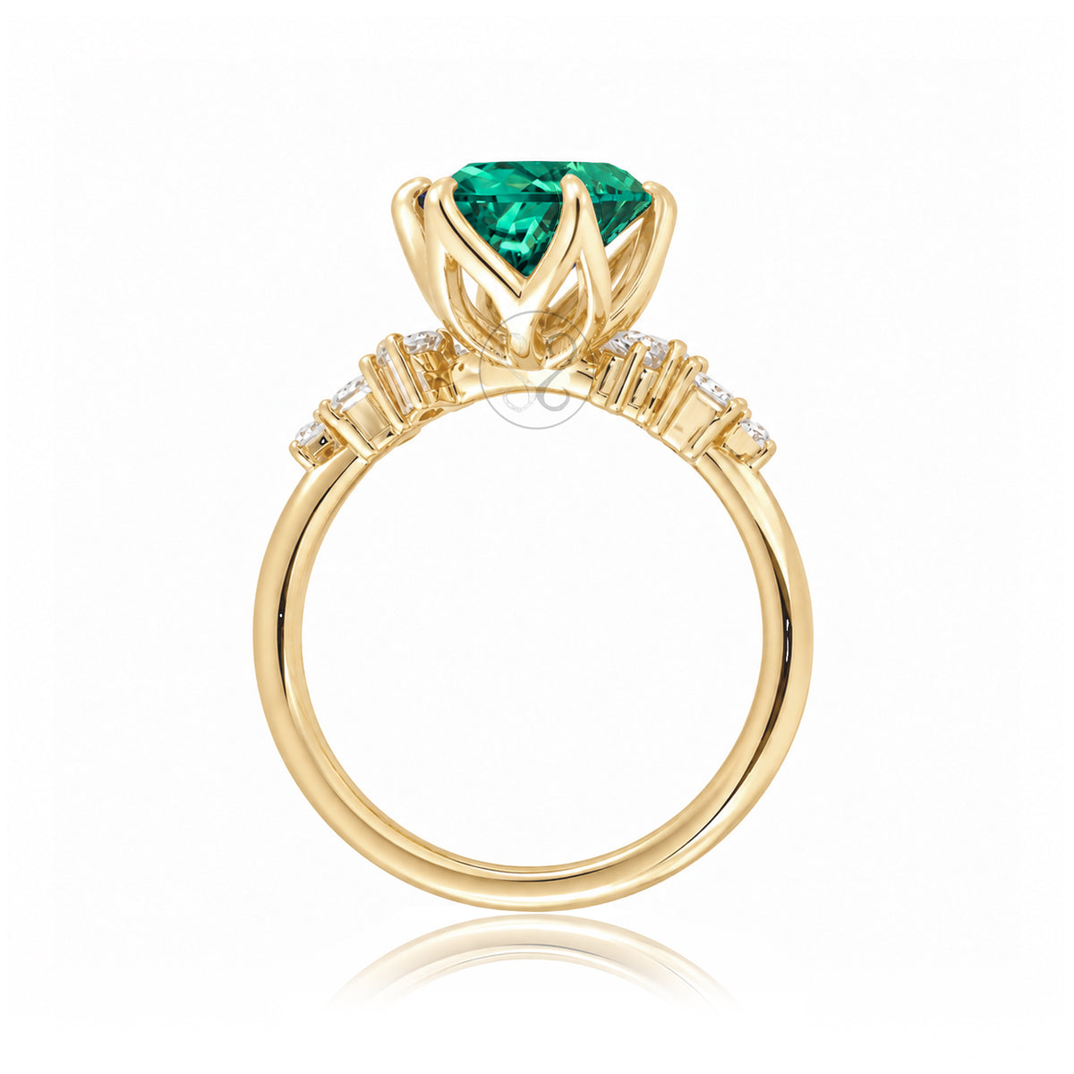 Oval emerald ring with diamond accent on yellow gold