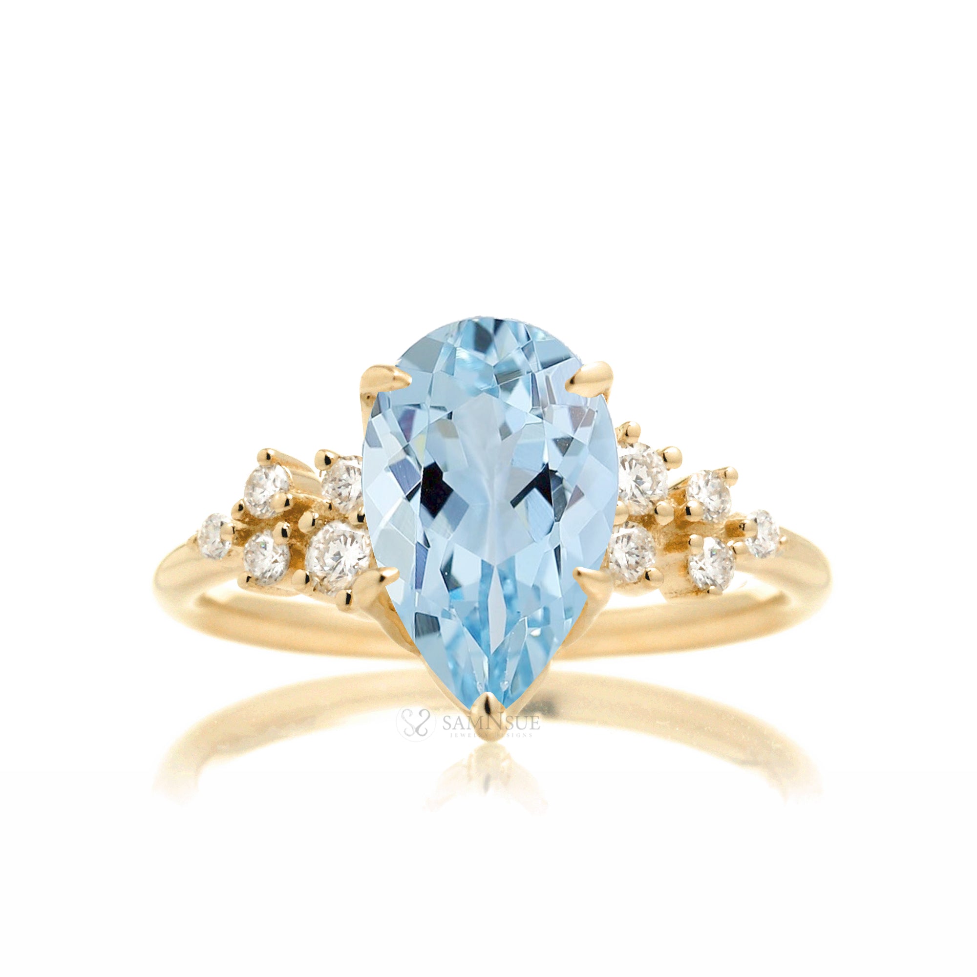 Pear aquamarine diamond three stone ring yellow gold