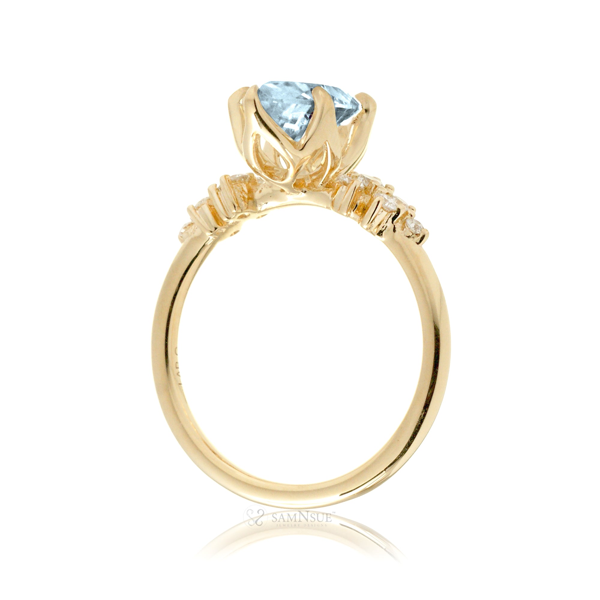 Pear aquamarine diamond three stone ring yellow gold