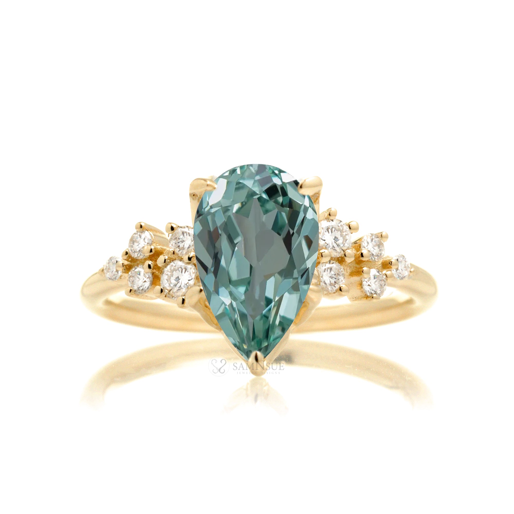 Green sapphire ring pear cut diamond three stone ring yellow gold