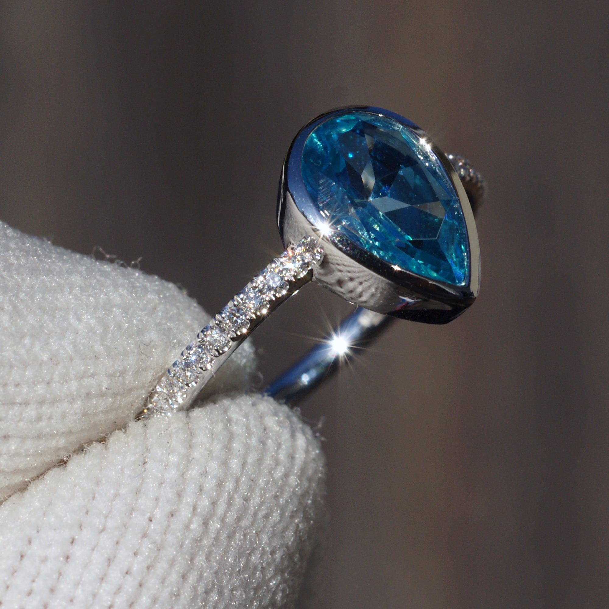 Blue topaz ring pear cut bezel set diamond band ring white gold