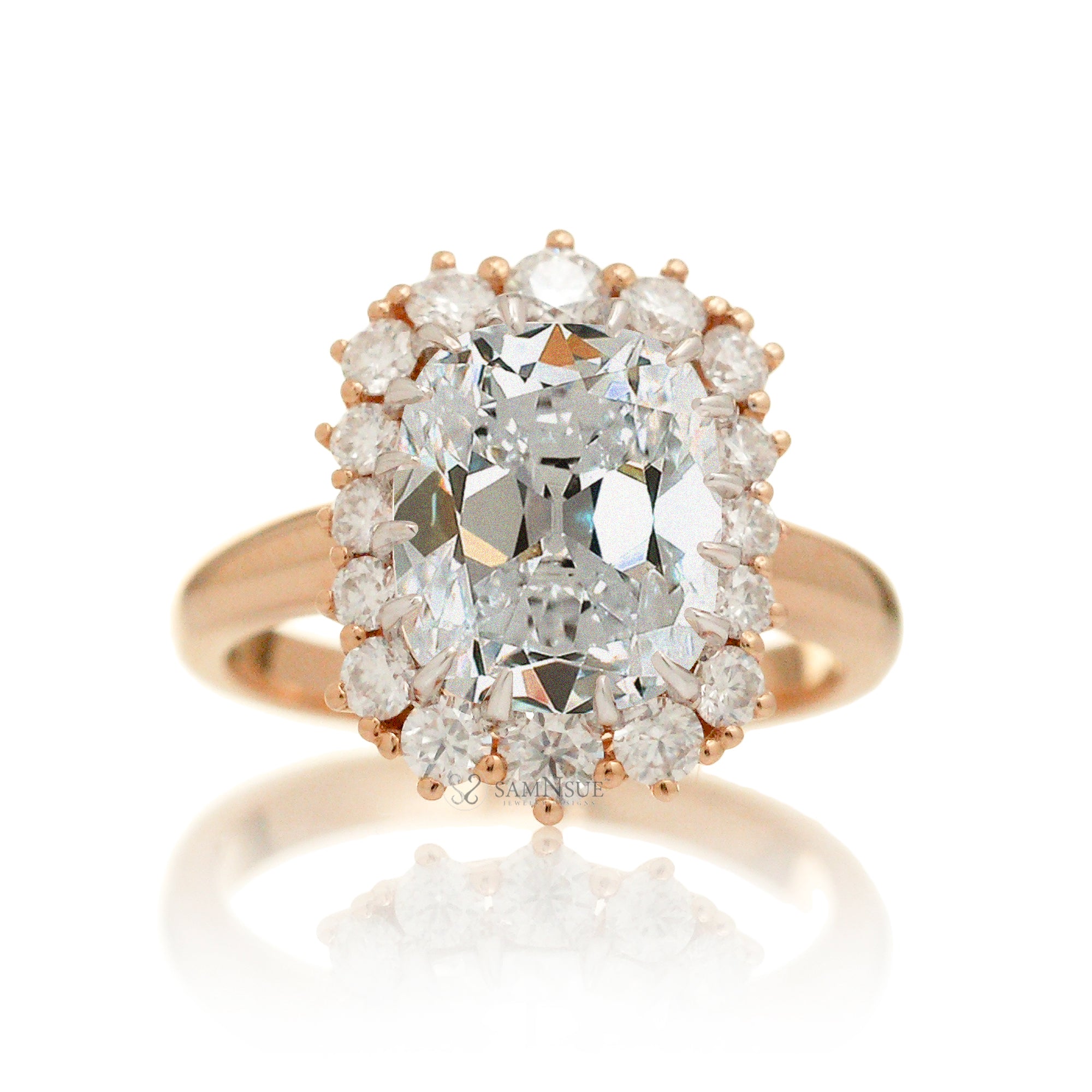Old mine cut diamond and halo vintage style ring rose gold