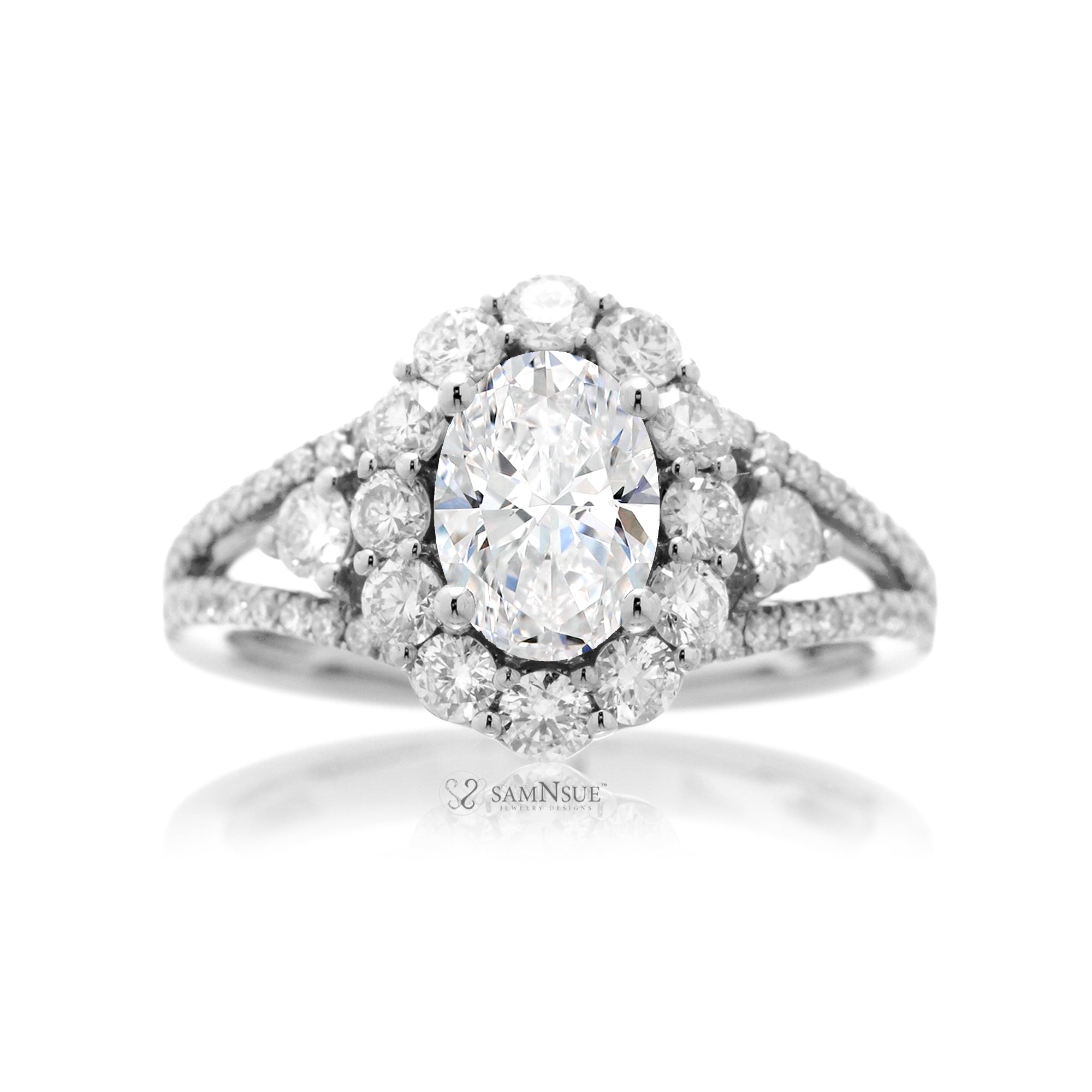 Oval diamond ring with halo split band and three stone design in white gold
