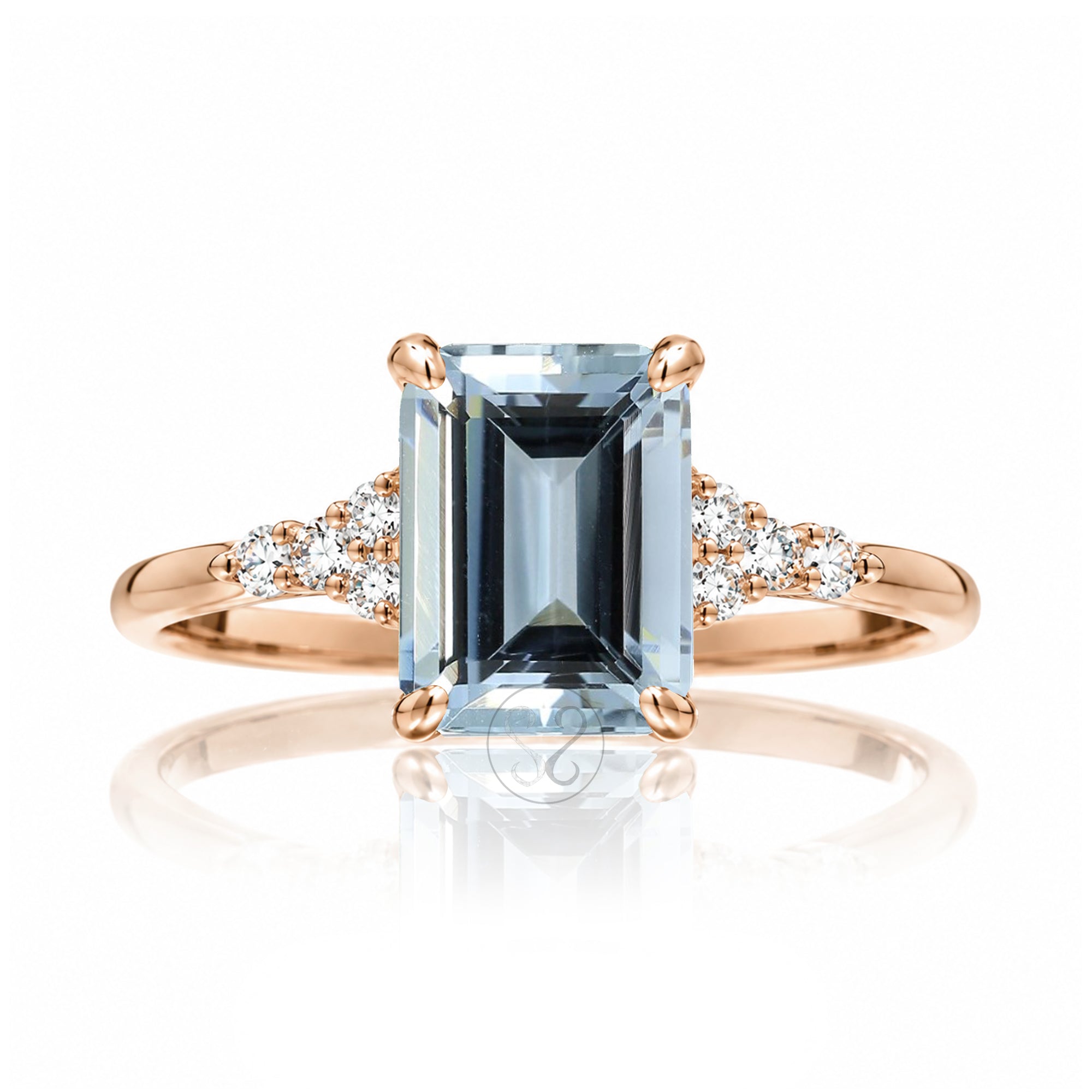 Aquamarine ring emerald cut with solid rounded band in rose gold