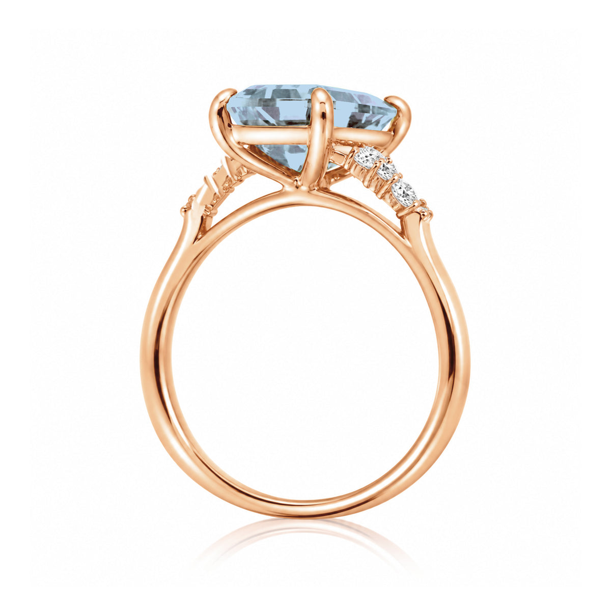 Aquamarine ring emerald cut with solid rounded band in rose gold
