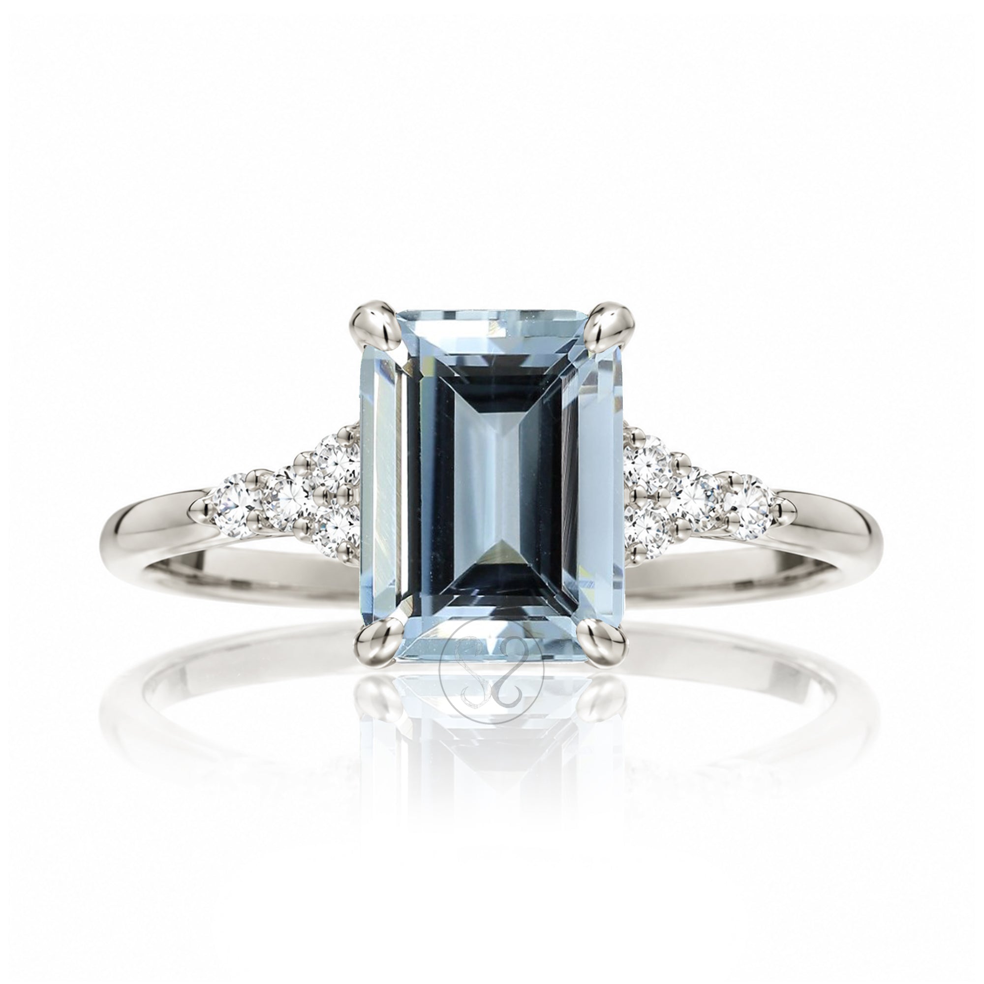 Aquamarine ring emerald cut with solid rounded band in white gold