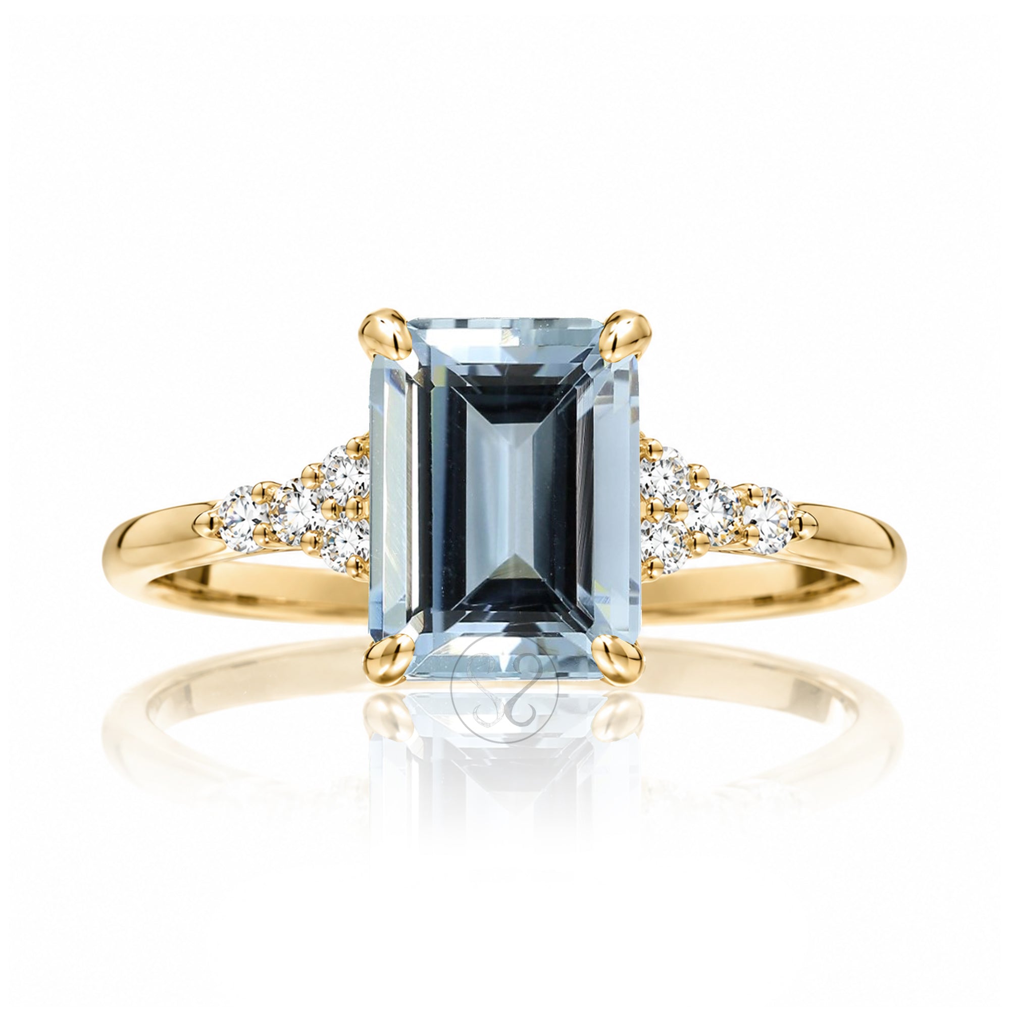 Aquamarine ring emerald cut with solid rounded band in yellow gold