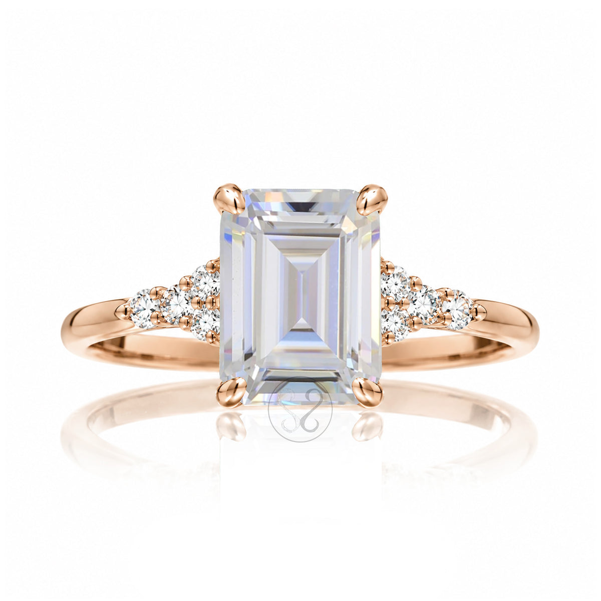 Emerald cut moissanite three stone diamond ring in rose gold