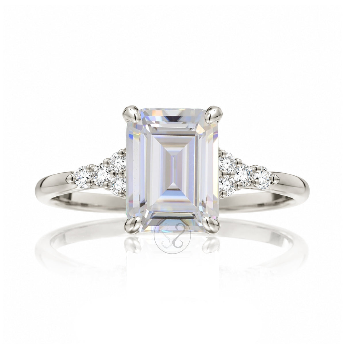 Emerald cut moissanite three stone diamond ring in white gold