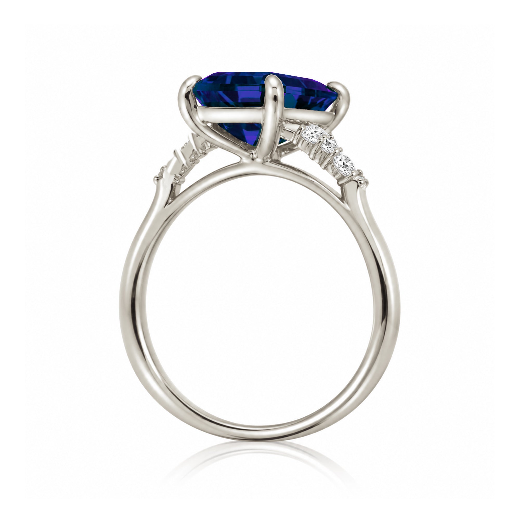Sapphire engagement ring with a blue step emerald cut lab-grown sapphire and diamond accent in white gold