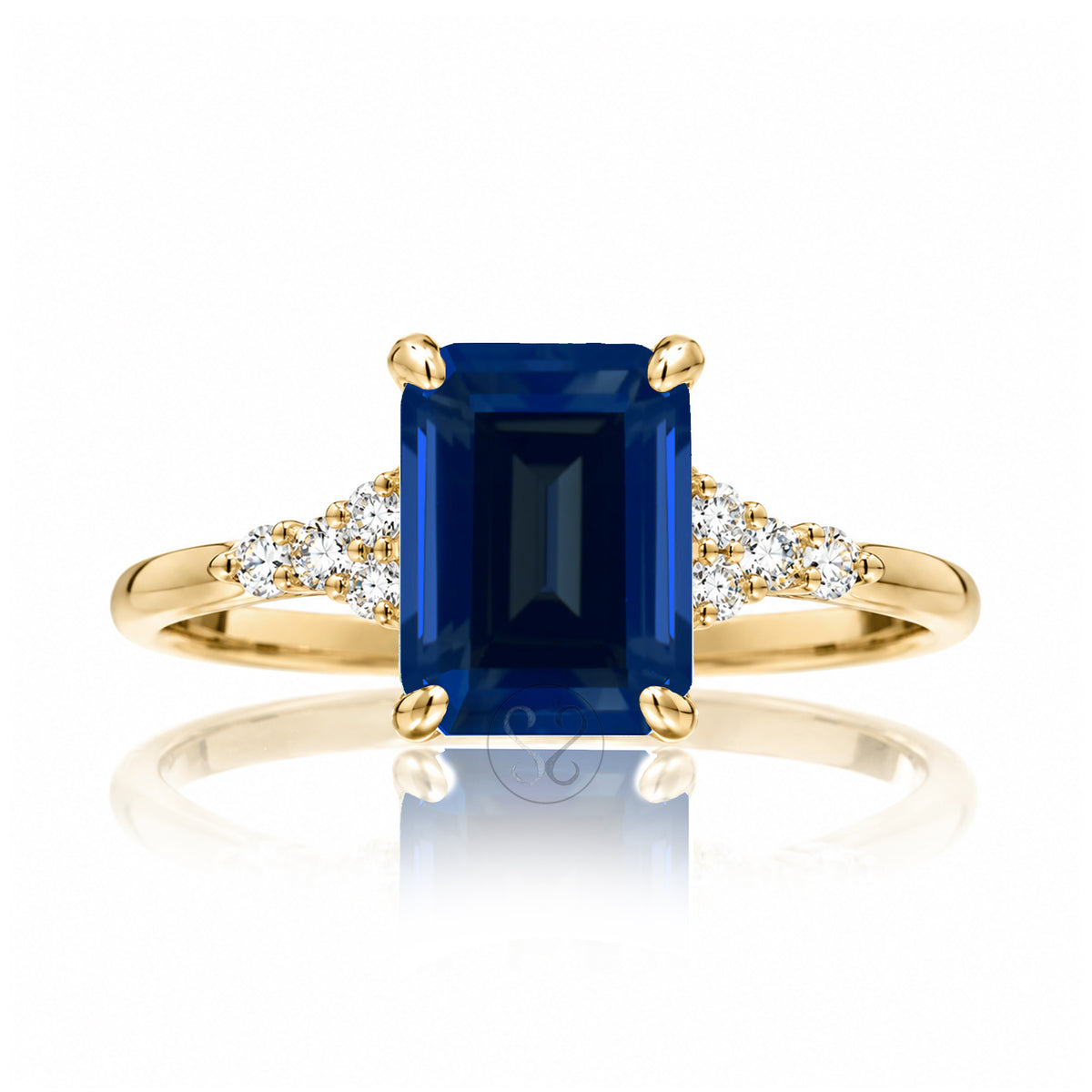 Sapphire engagement ring with a blue step emerald cut lab-grown sapphire and diamond accent in yellow gold