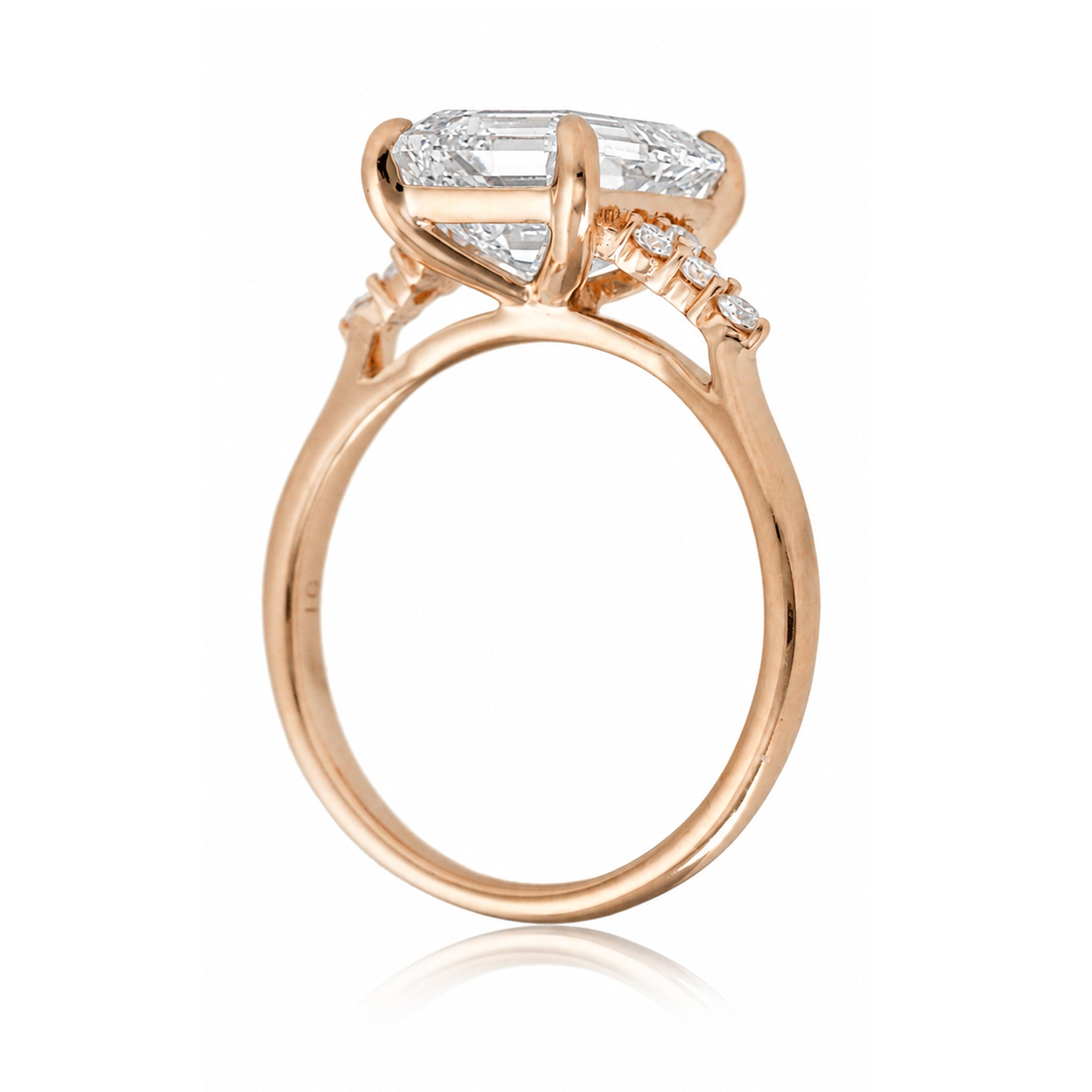 Emerald step cut diamond engagement ring in rose gold