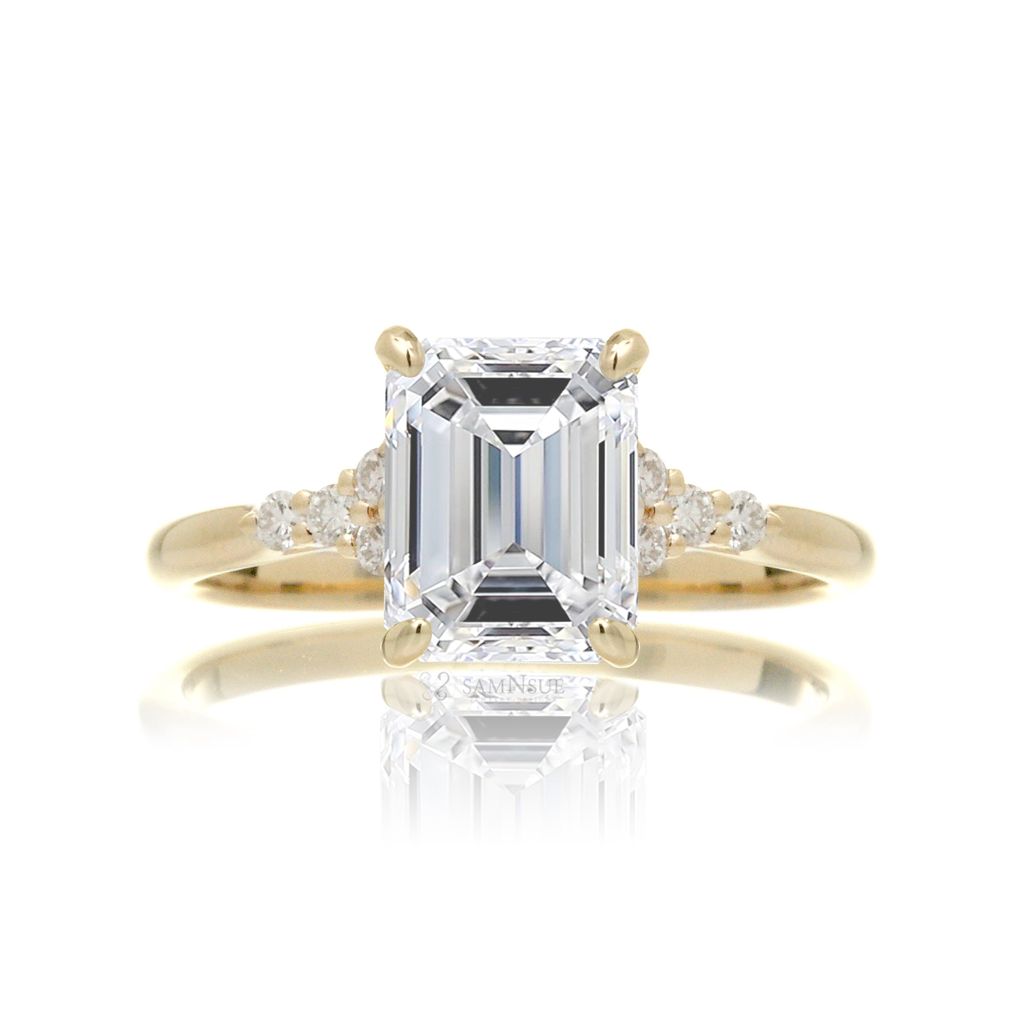 Emerald step cut diamond engagement ring in yellow gold