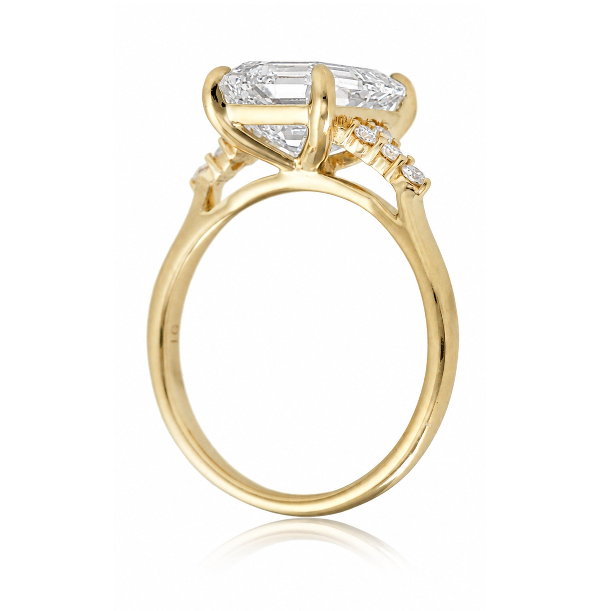 Emerald step cut diamond engagement ring in yellow gold