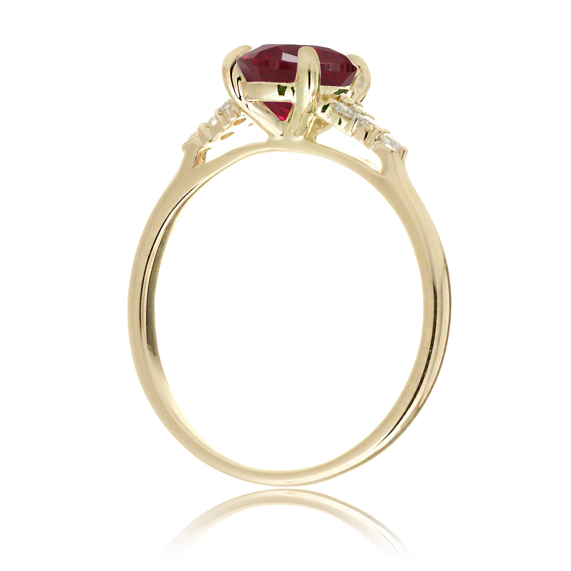 Emerald cut ruby and diamond three stone ring in yellow gold
