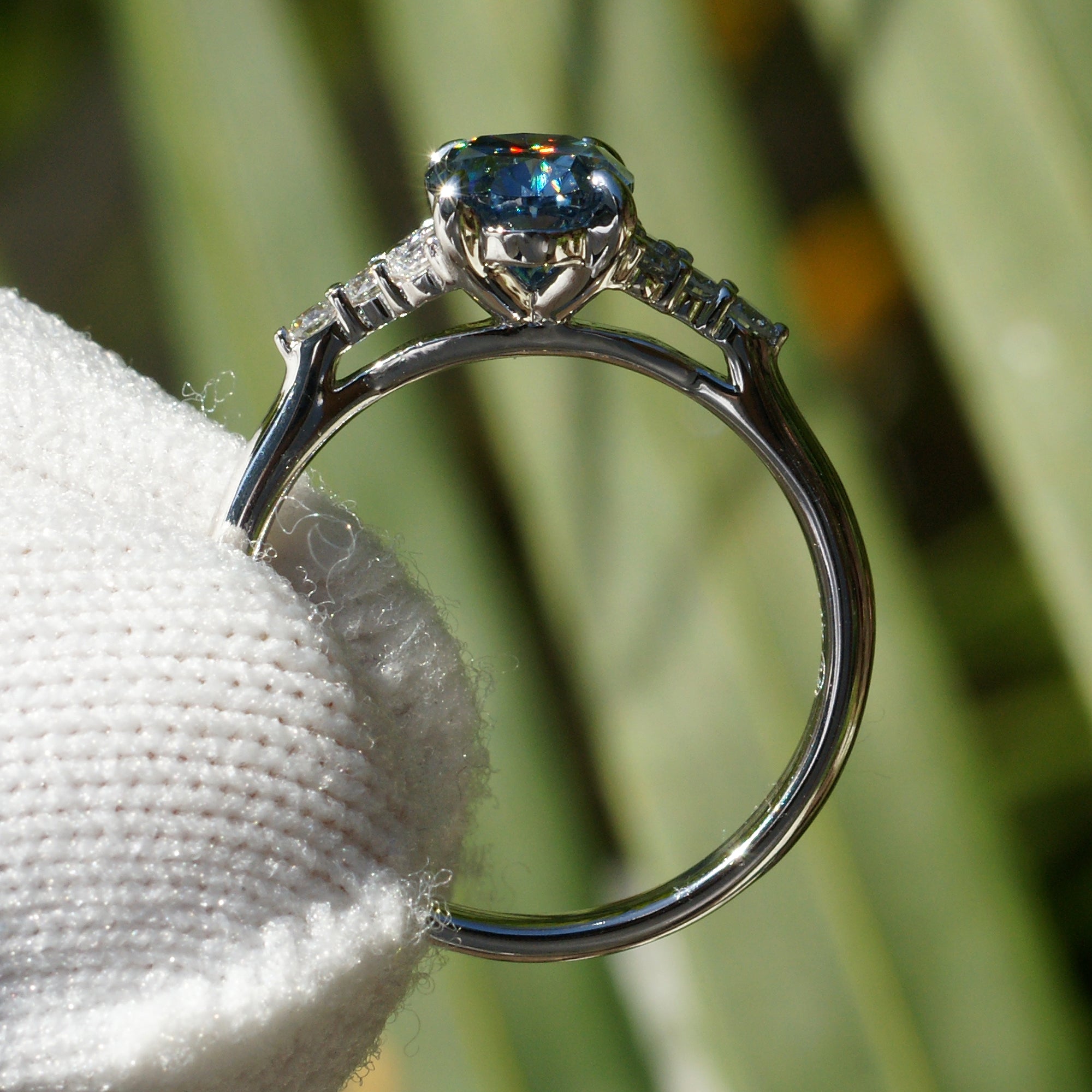 Oval grey blue moissanite and diamond three stone engagement ring in white gold