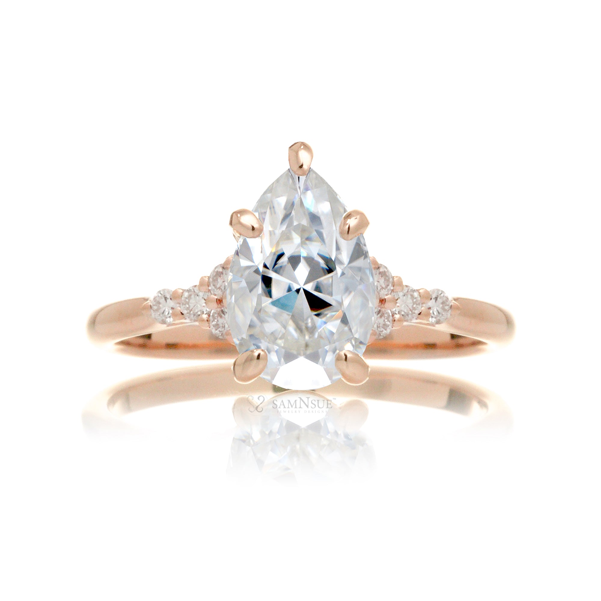 Pear moissanite ring with diamond accent on rose gold - the Chloe