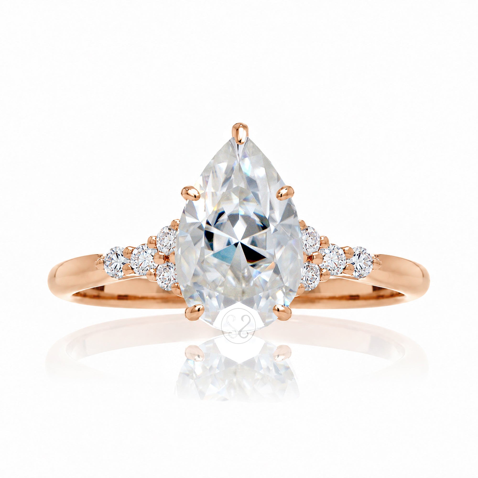 Pear moissanite ring with diamond accent on rose gold - the Chloe