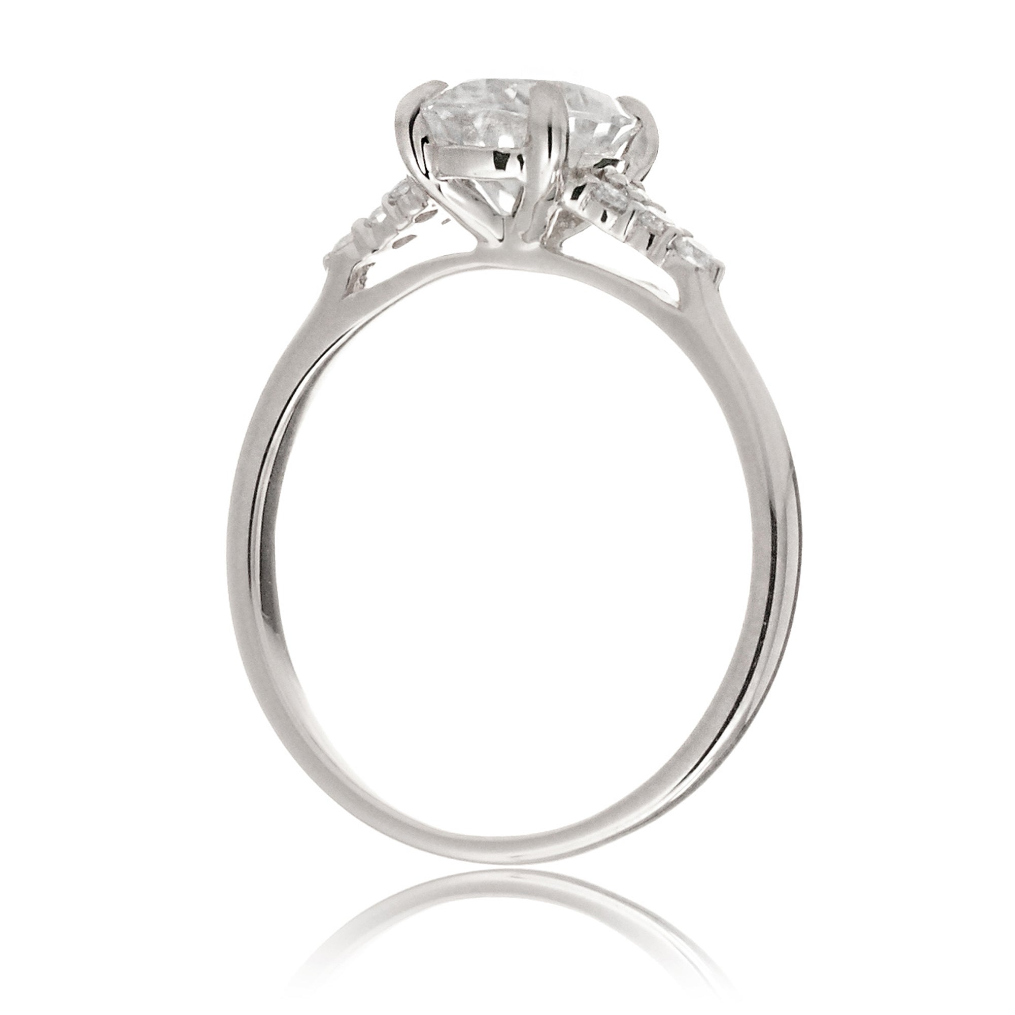 Pear moissanite ring with diamond accent on white gold - the Chloe