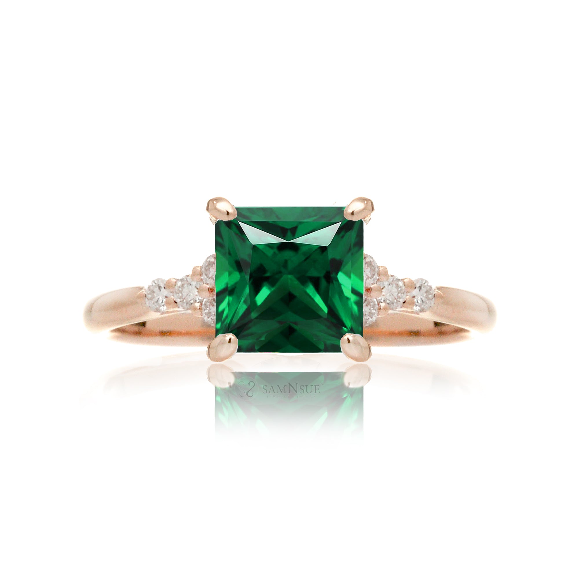 Emerald engagement ring with princess cut and diamond accent in rose gold