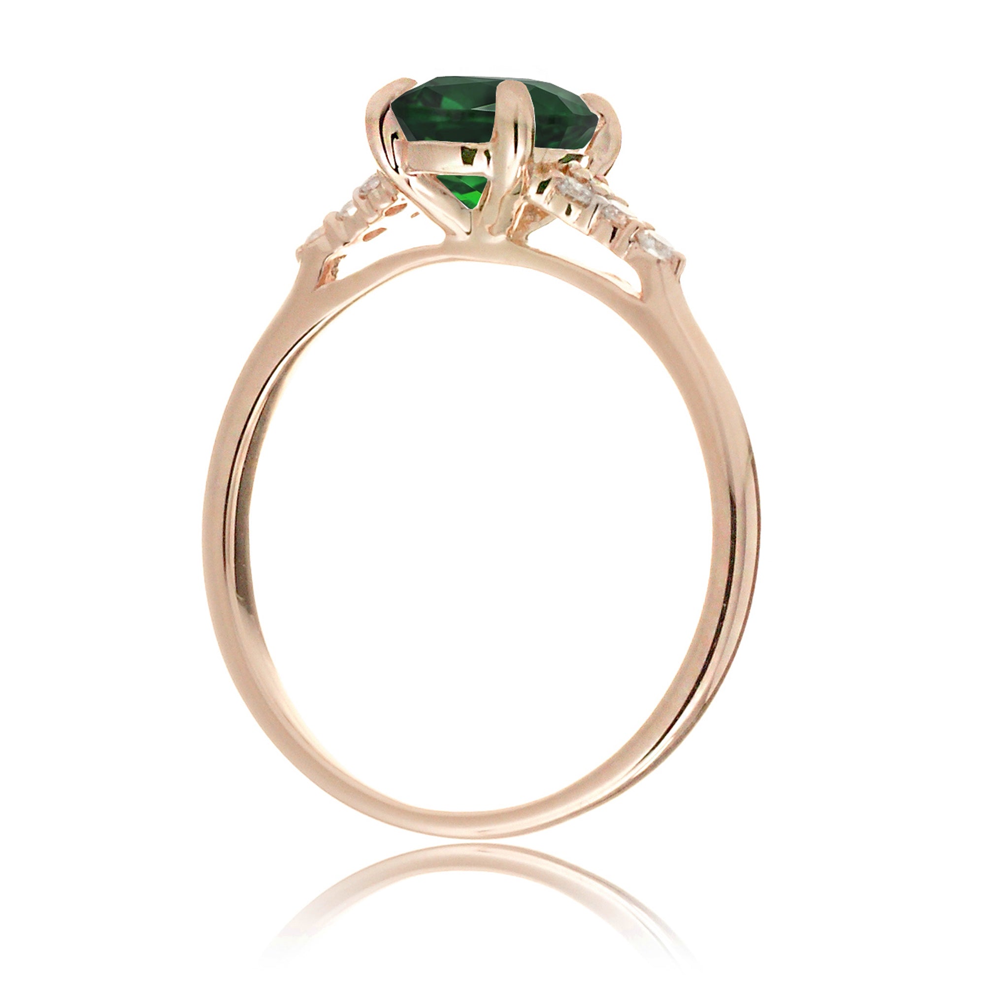 Emerald engagement ring with princess cut and diamond accent in rose gold