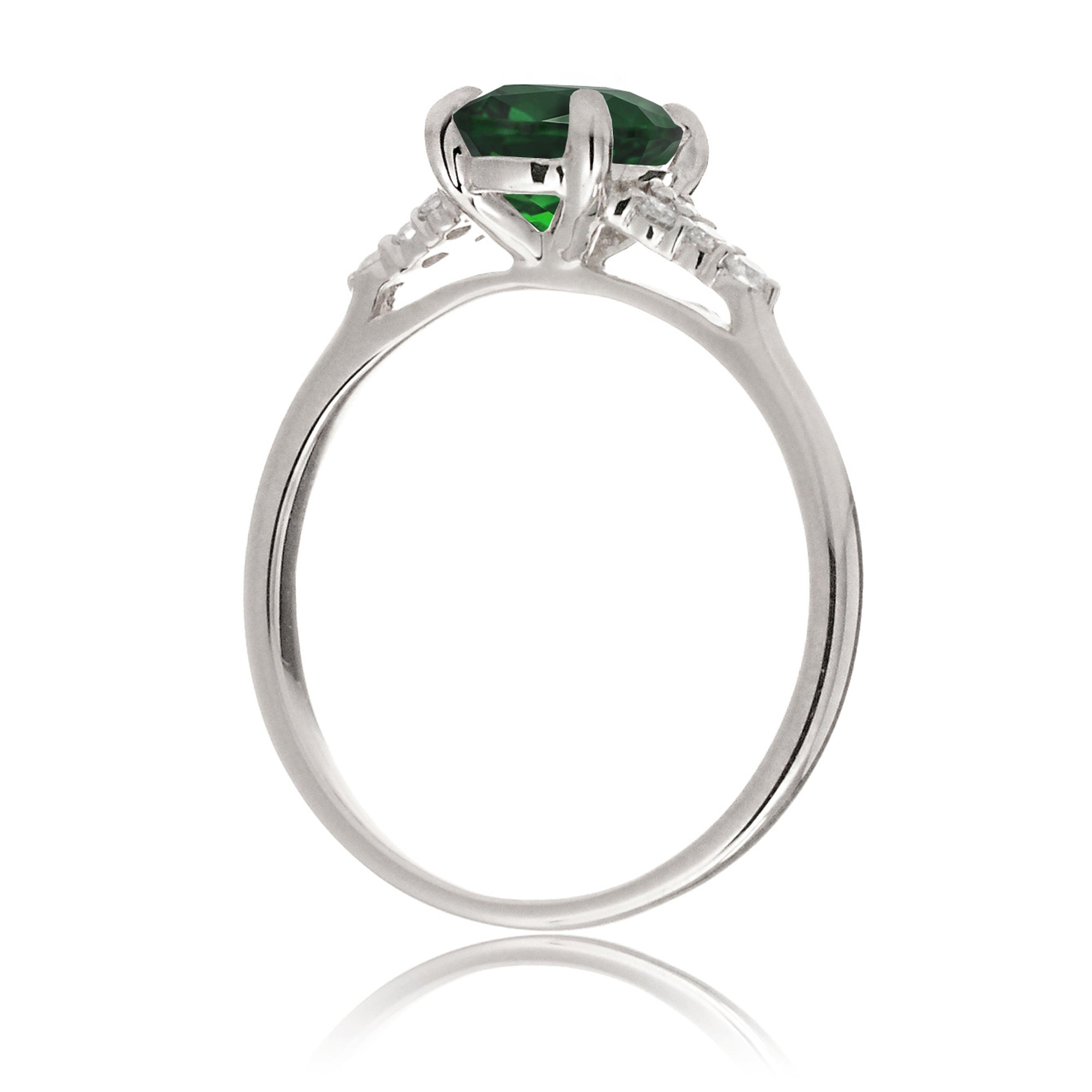Emerald engagement ring with princess cut and diamond accent in white gold