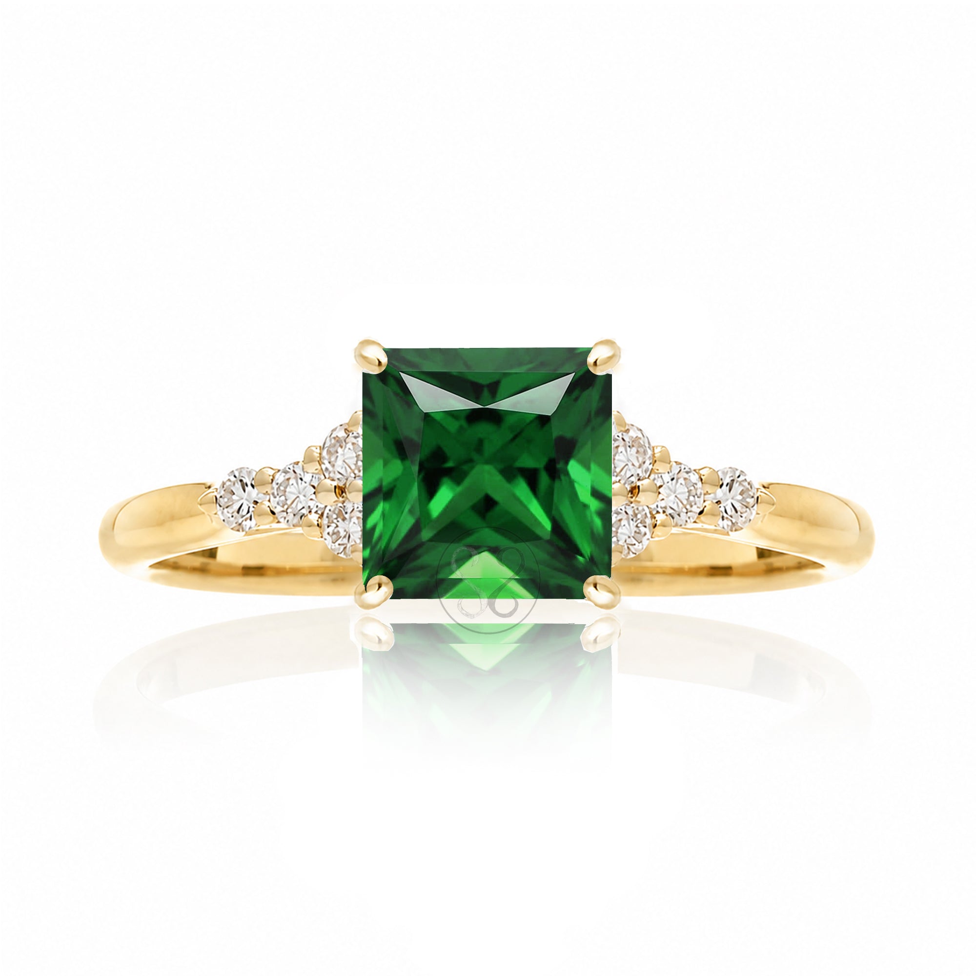 Emerald engagement ring with princess cut and diamond accent in yellow gold